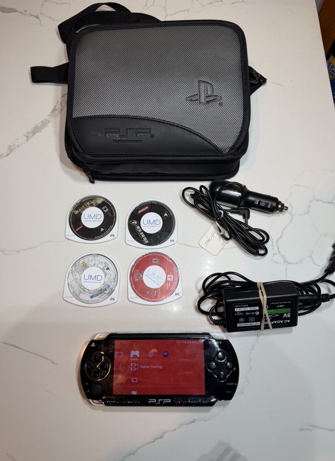 Sony PSP-1001 PlayStation Portable – Black w/ Games + Case + Cables