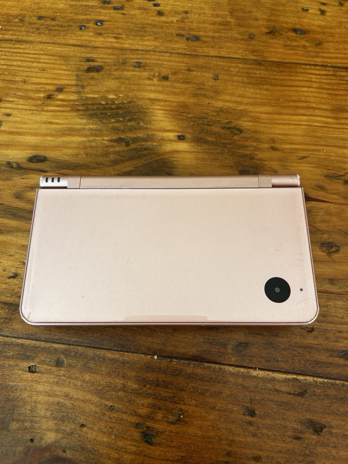 Nintendo DSi XL Metallic Rose Handheld System (No charger, pen or accessories)