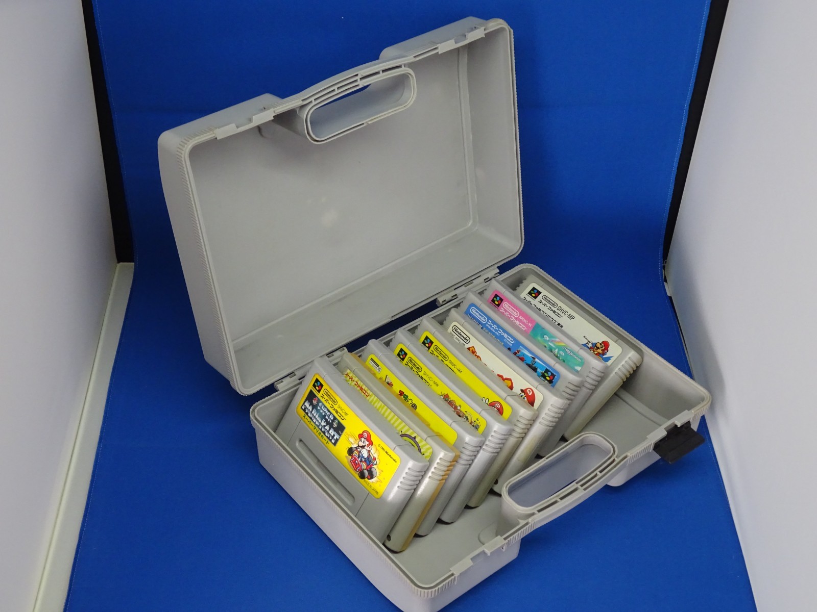 SNES case for Super Mario Kart, Super Mario World, and Super Picross.SNES shelf