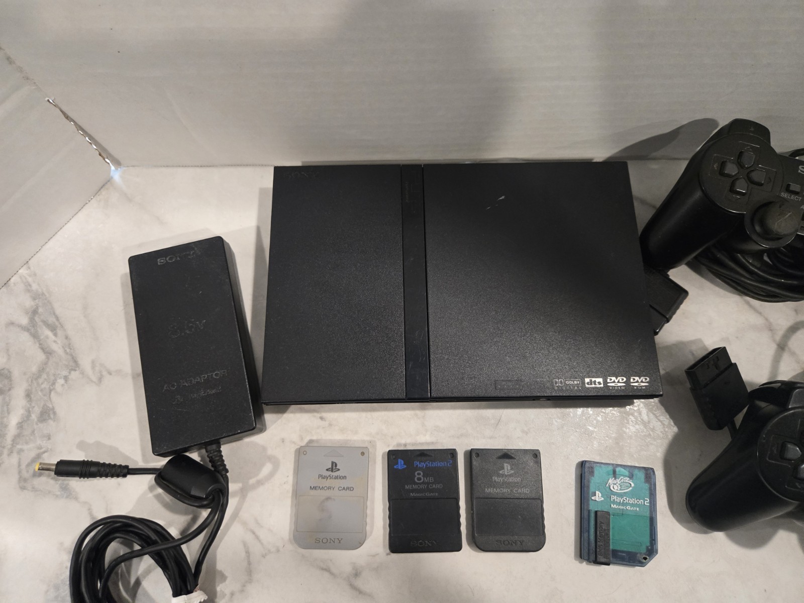 Sony PlayStation 2 Slim Black SCPH-70012 Bundle-2 Controllers & 4 Memory Cards
