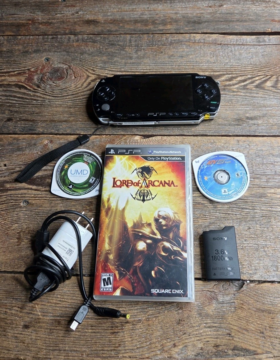 Sony PSP Black System With Charger, 3 Games (Description), And 2 Batteries