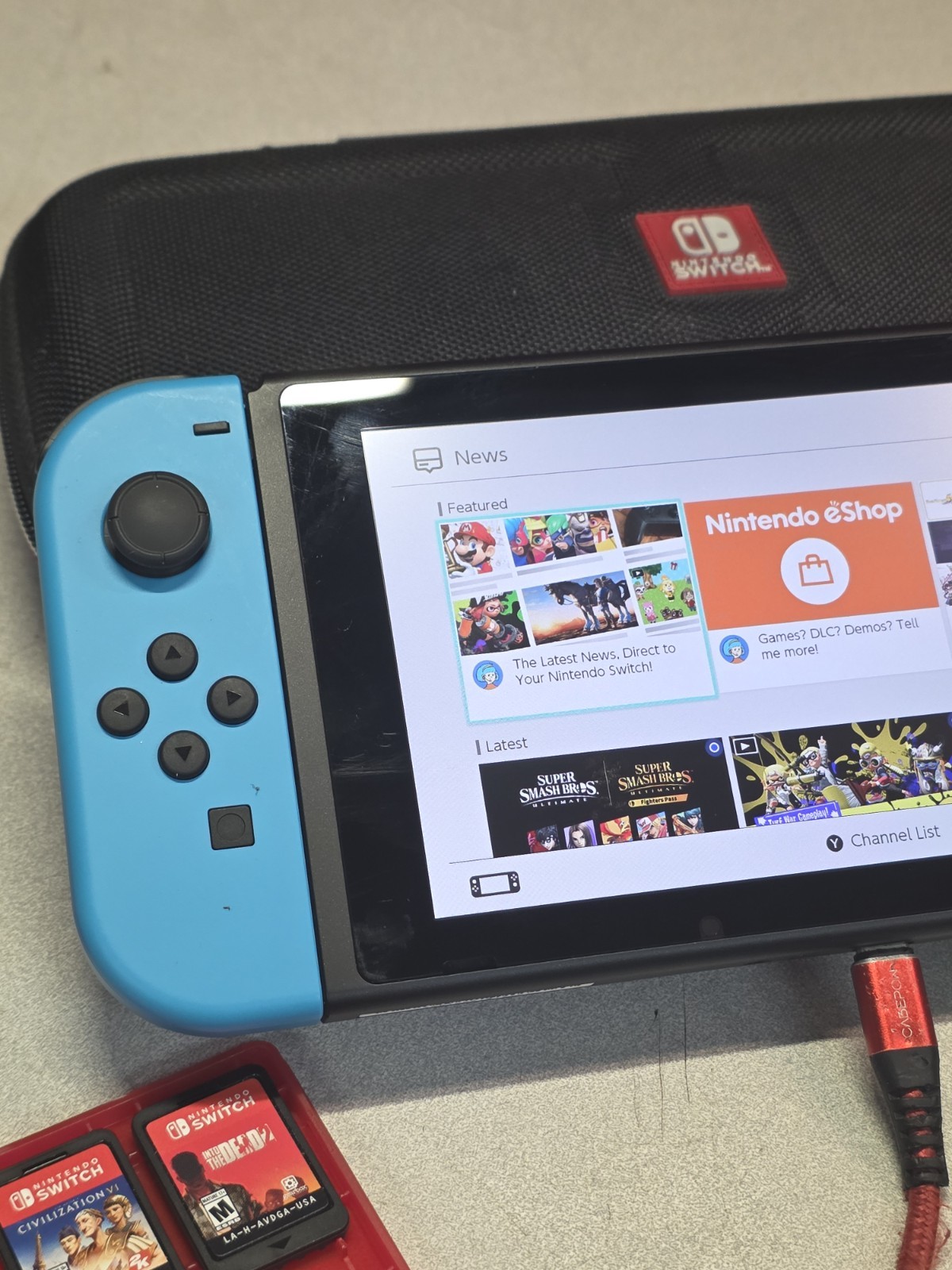 Nintendo Switch Console Red/ Blue w/ case & 3 Games