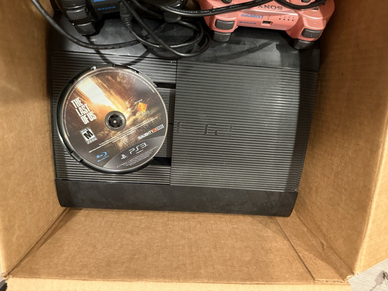 Sony PS3 Super Slim CECH-4001B ，Includes 2 Controllers and game lots
