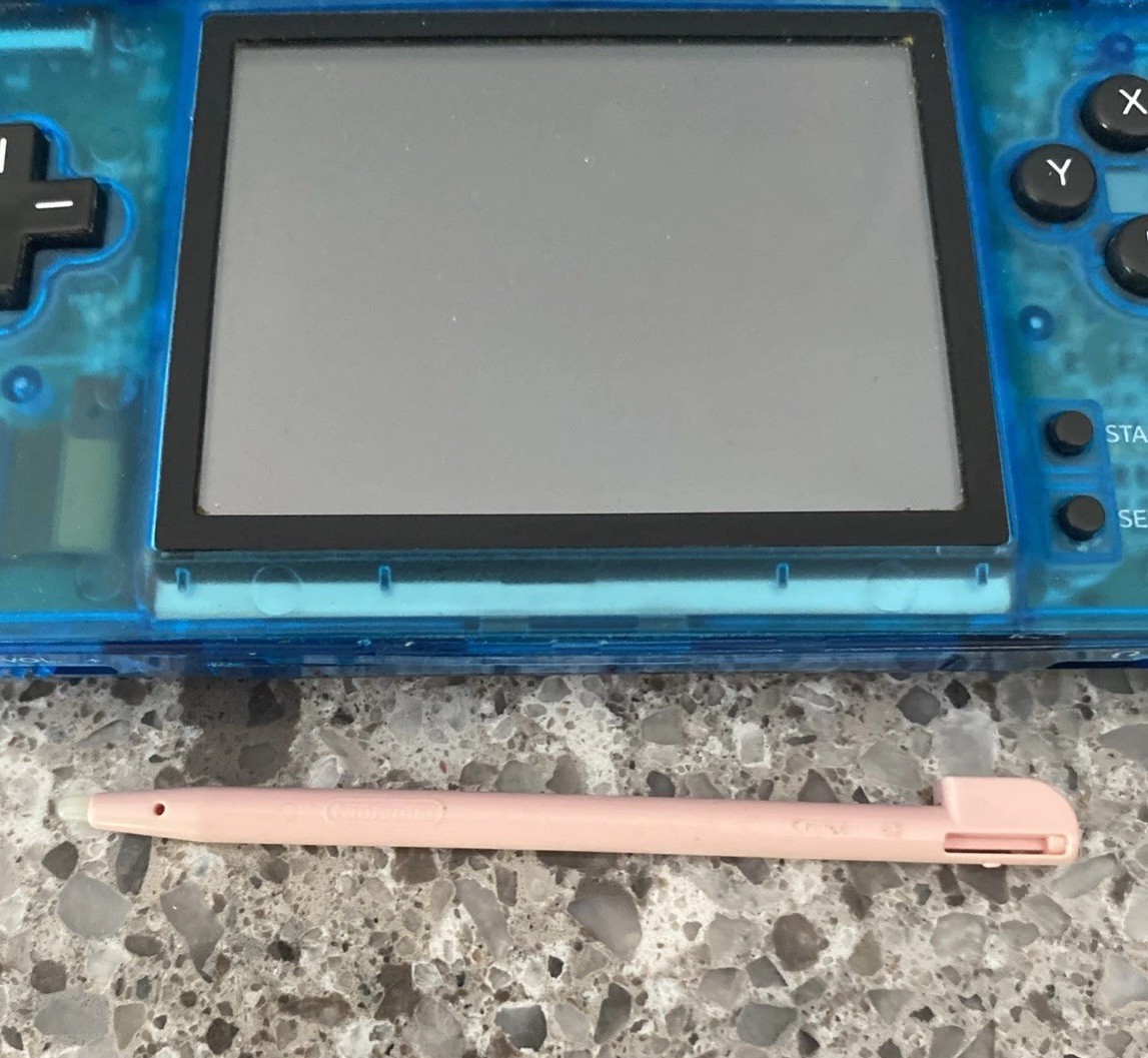 Nintendo DSi Handheld Game Console Clear Blue – No Charger – Pink Stylus