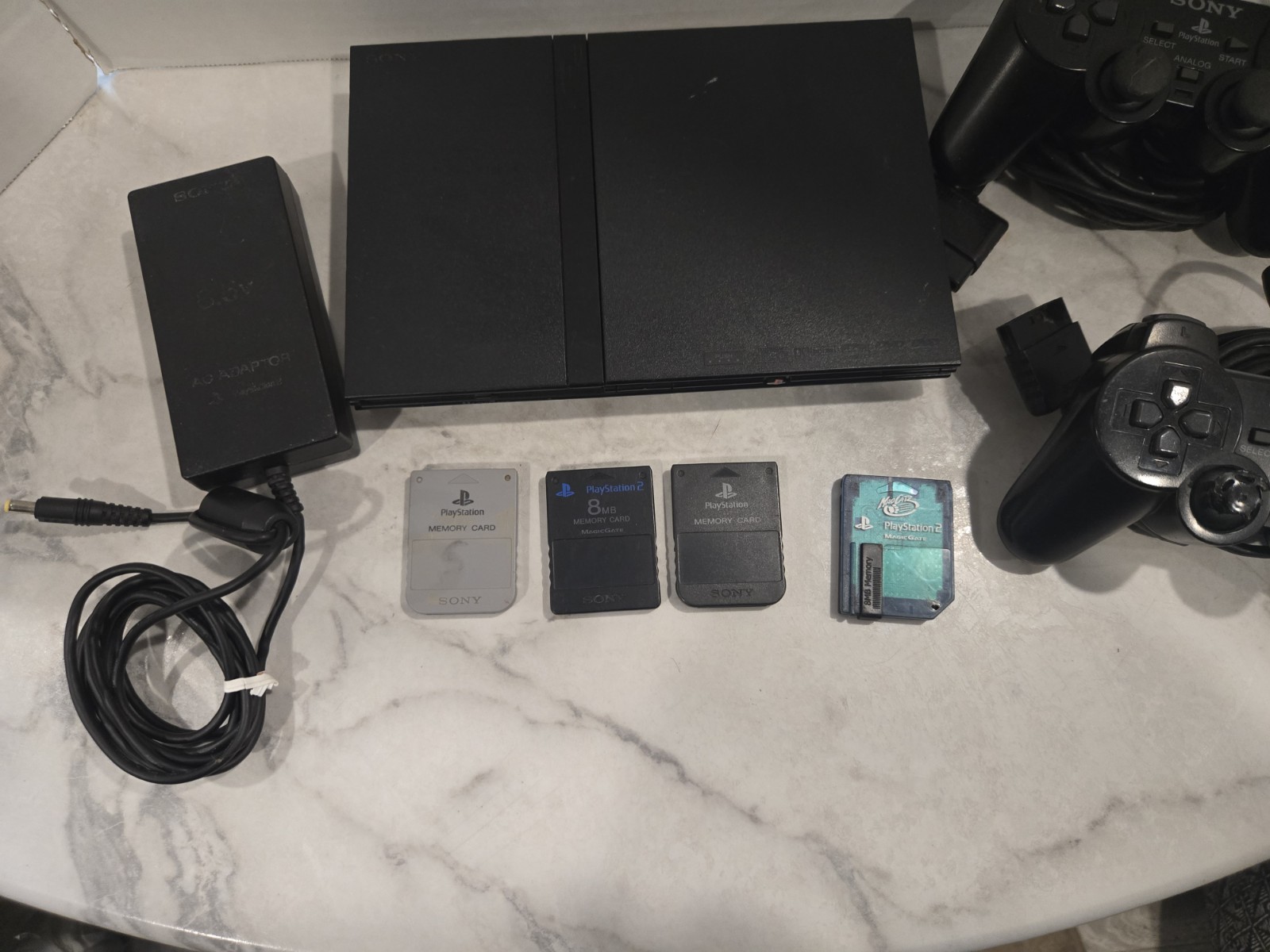 Sony PlayStation 2 Slim Black SCPH-70012 Bundle-2 Controllers & 4 Memory Cards