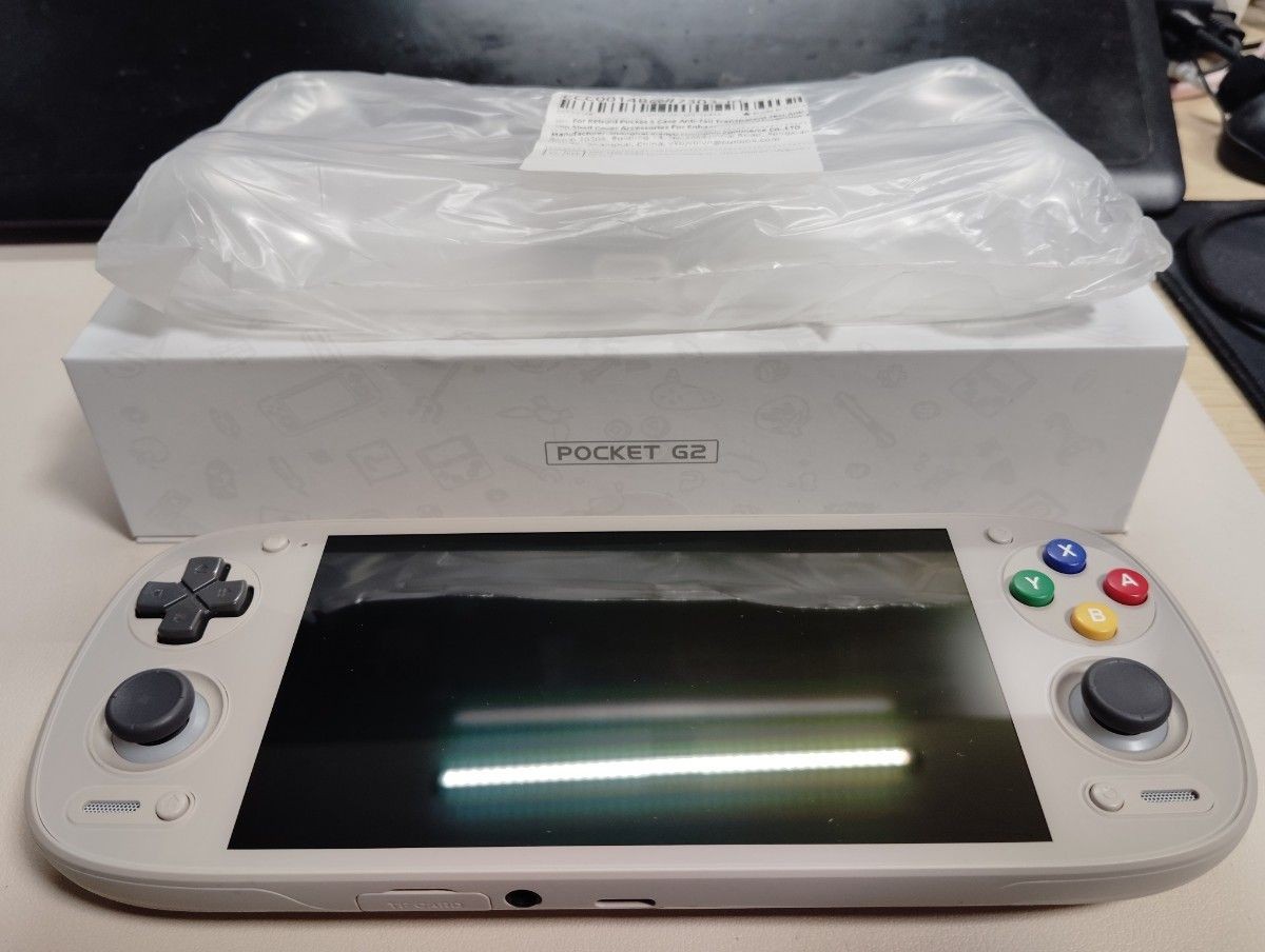 Retroid Pocket G2 handheld game console, 16-bit color, used, TPU case included.