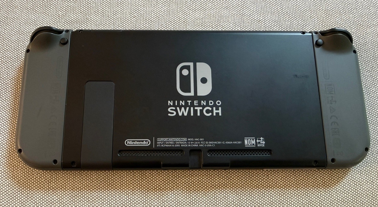 Nintendo Switch with 2 extra joy-cons, dock, holder, case, charger, SD, and box