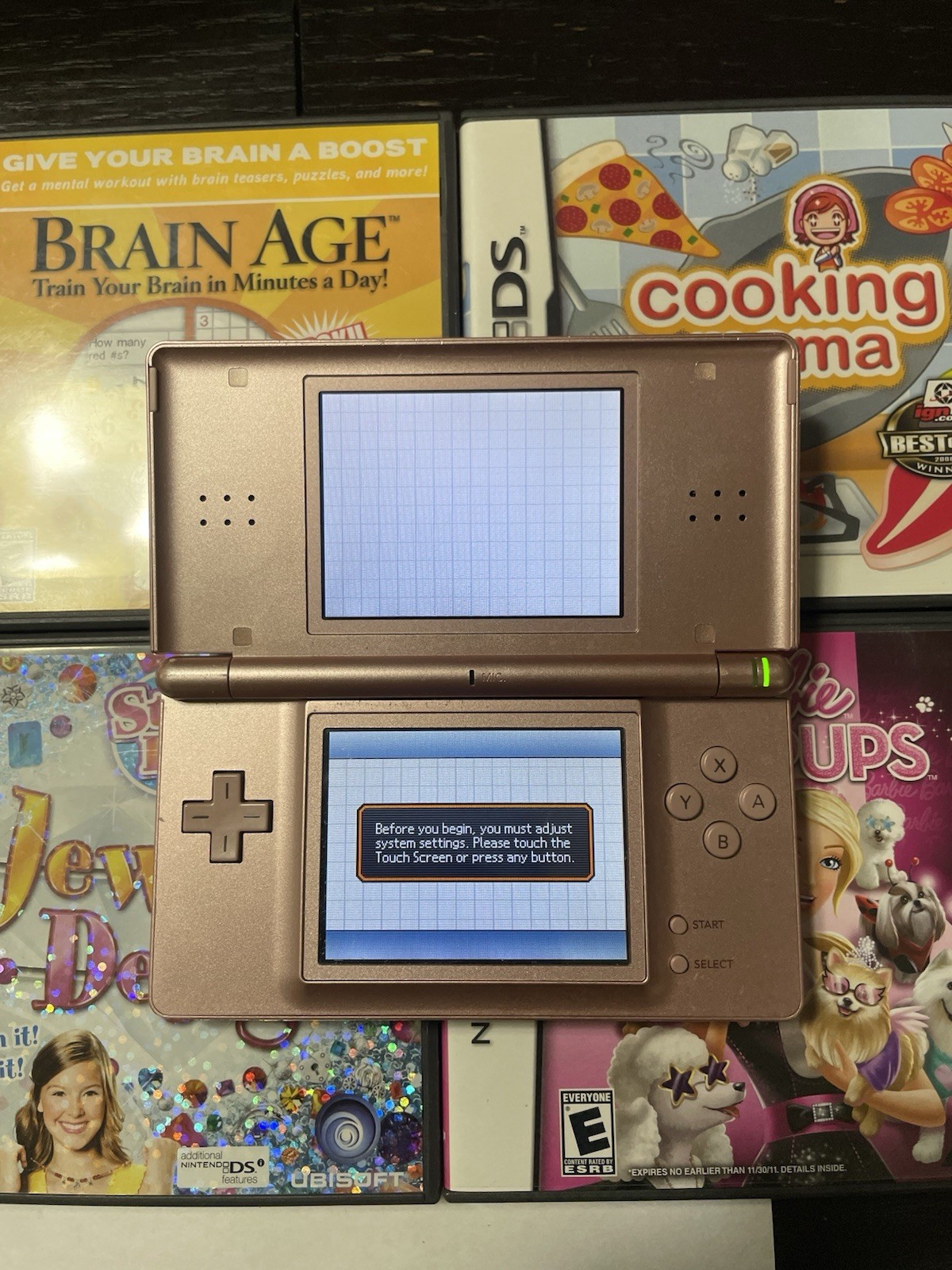 Nintendo DS Lite Handheld Console Lot 7 Games No Charger or Stylus Pink