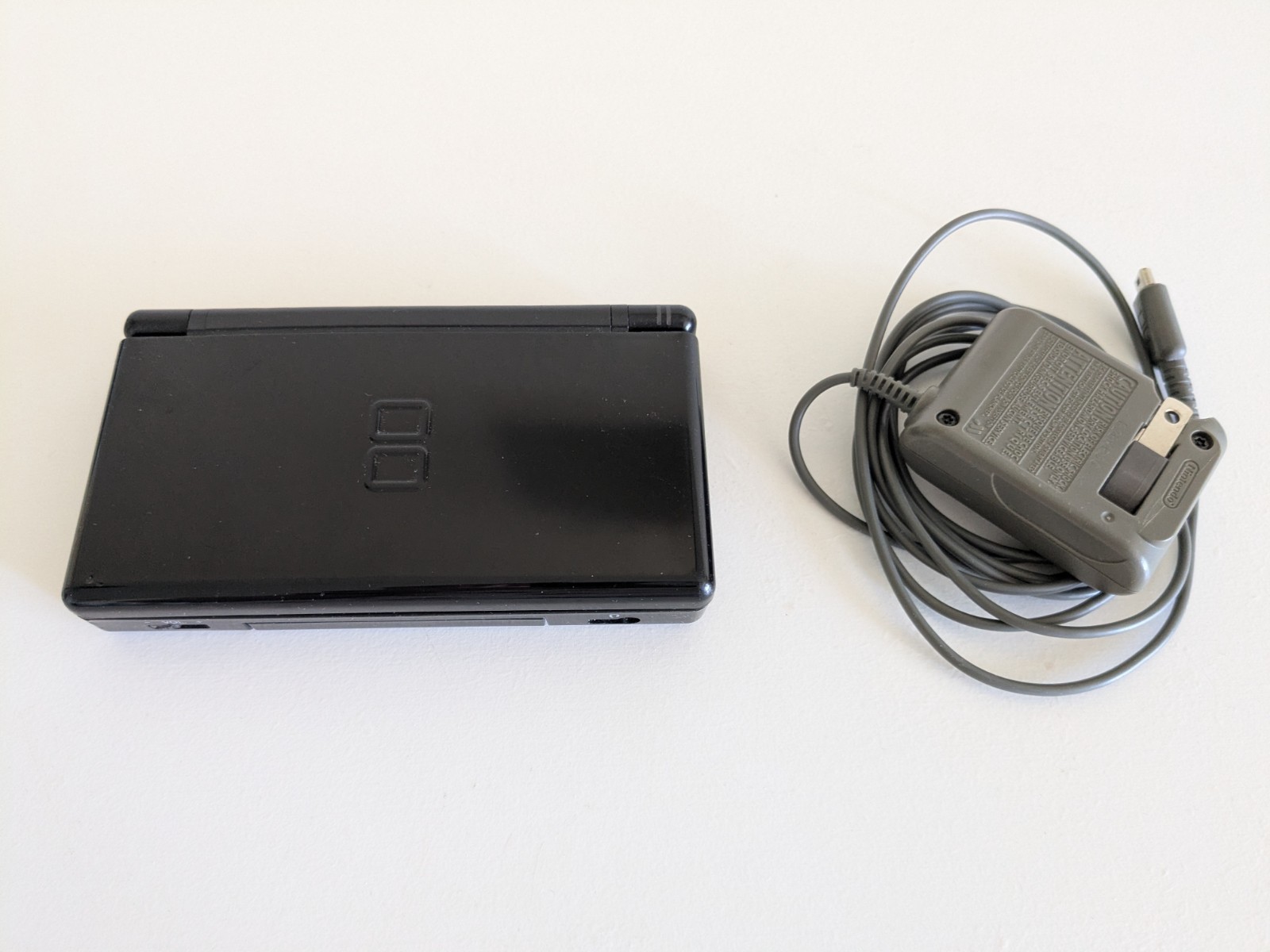 Nintendo DS Lite Black, with Charger (NO stylus) + Lot Of 28 Games – Used, Good