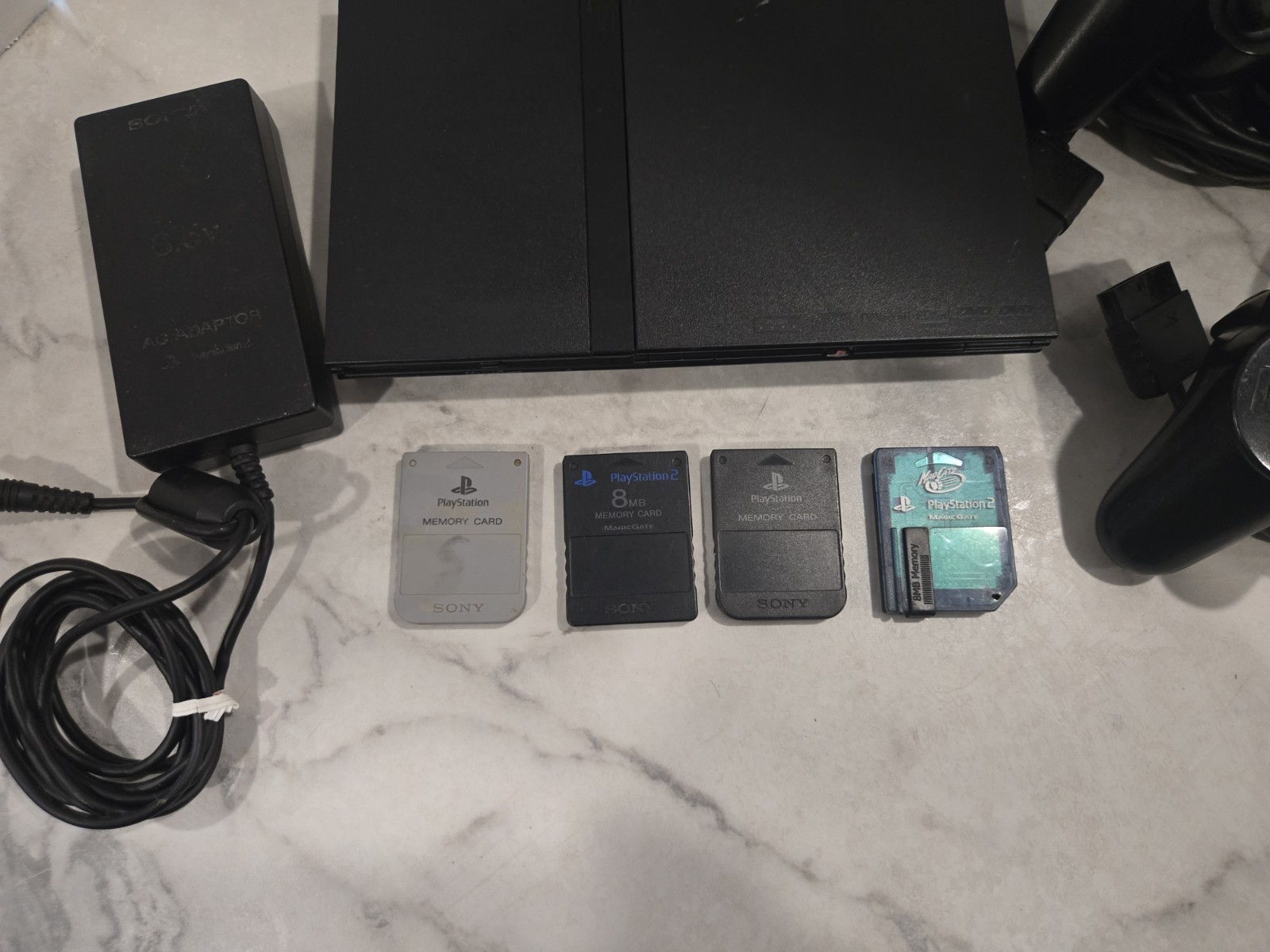 Sony PlayStation 2 Slim Black SCPH-70012 Bundle-2 Controllers & 4 Memory Cards