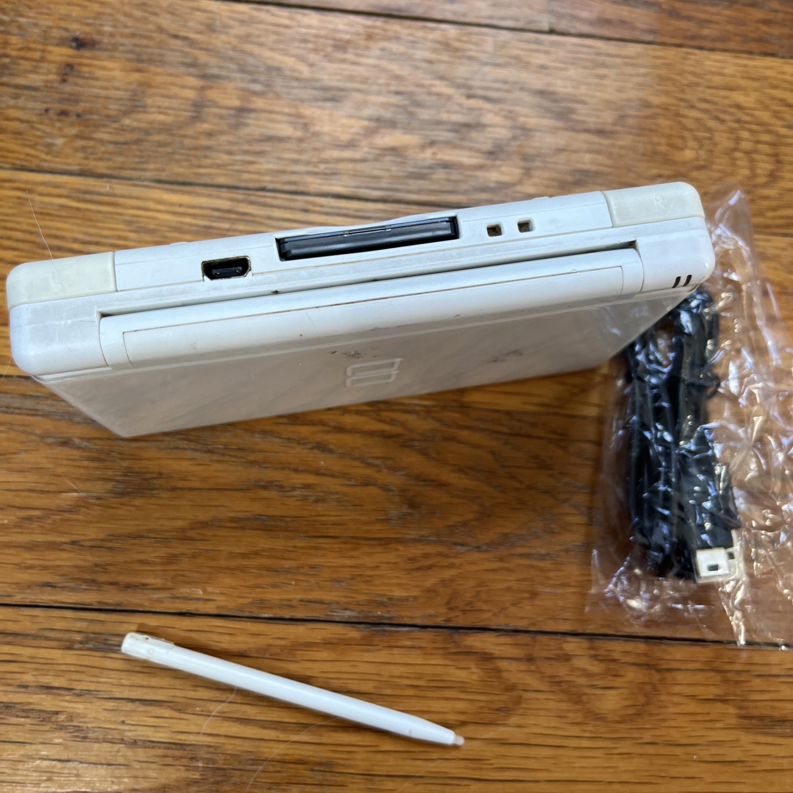 Nintendo DS Lite Handheld Console – Polar White and game charger stylus works