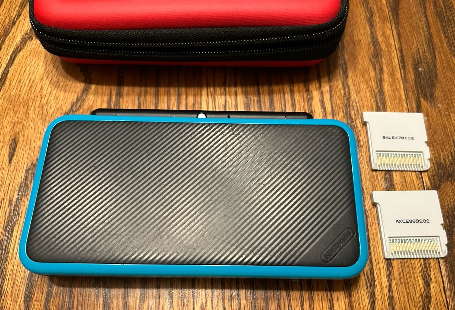 Nintendo 2DS XL Handheld Console w Mario Kart 7 Black/Turquoise Kirby Smash Case
