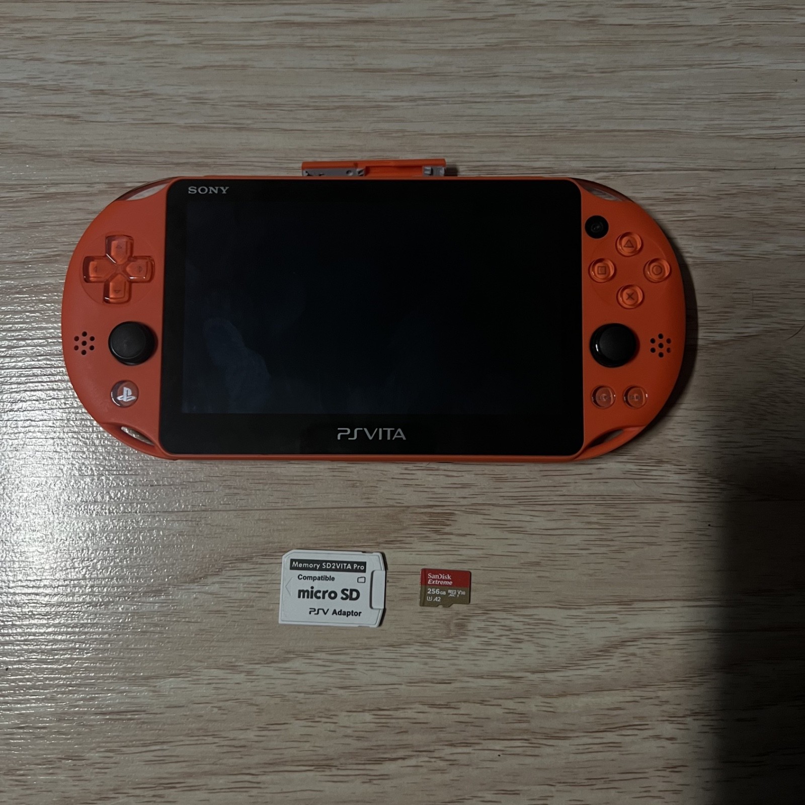 Sony PS Vita 2000 Neon Orange EX Region Free Console w Charger Micro SD 256GB