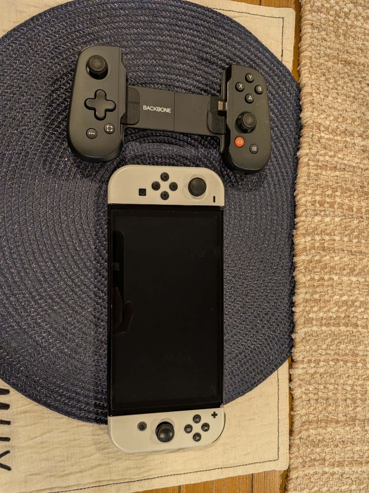 Nintendo Switch OLED- White with Backbone Handheld controller