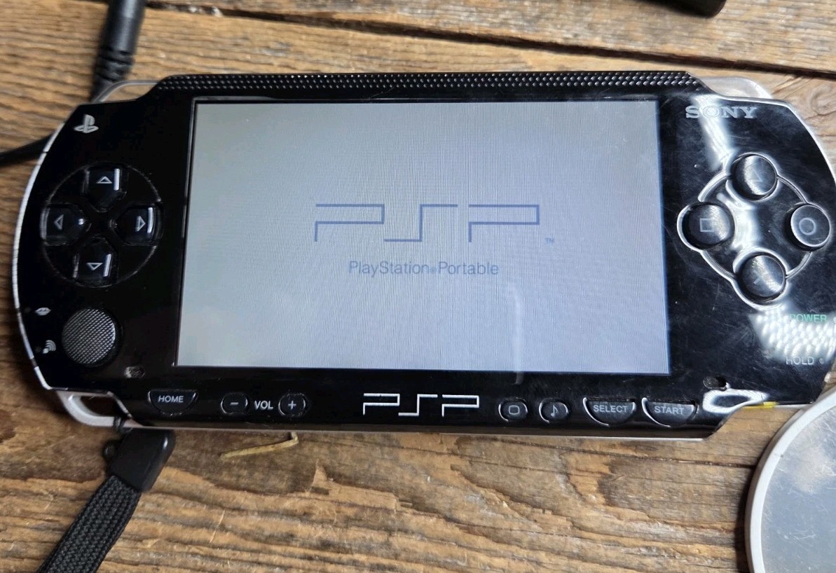 Sony PSP Black System With Charger, 3 Games (Description), And 2 Batteries
