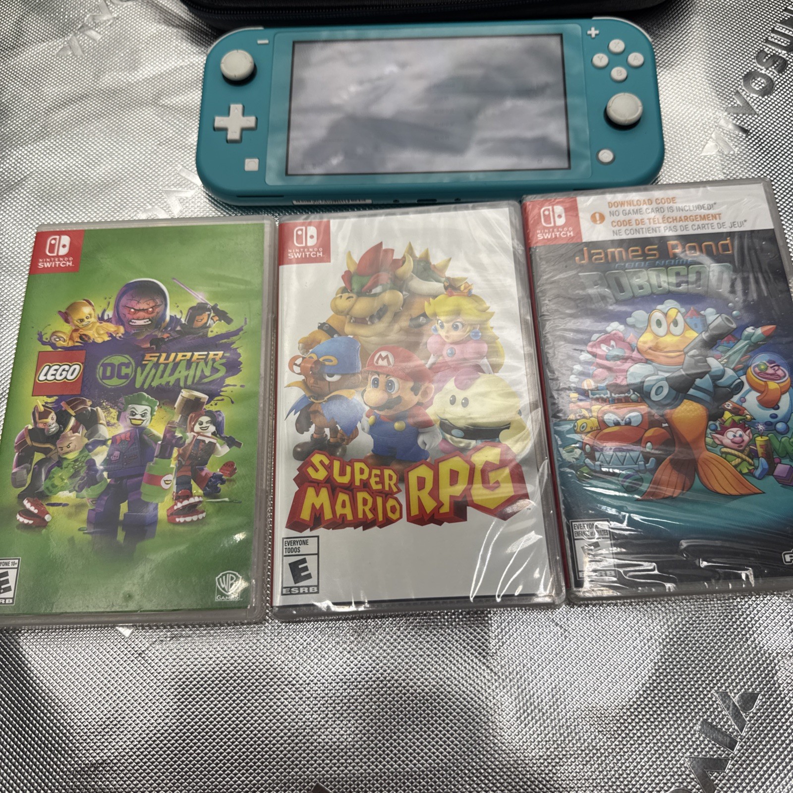 Nintendo Switch Lite 32GB Turquoise Handheld Gaming Console W/3 Games Mario Case