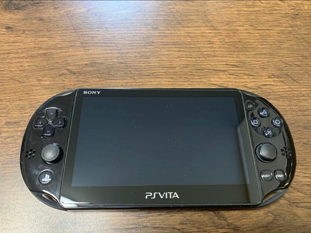 Good Condition PS Vita 2000 console charger 8GB memory card 2 games
