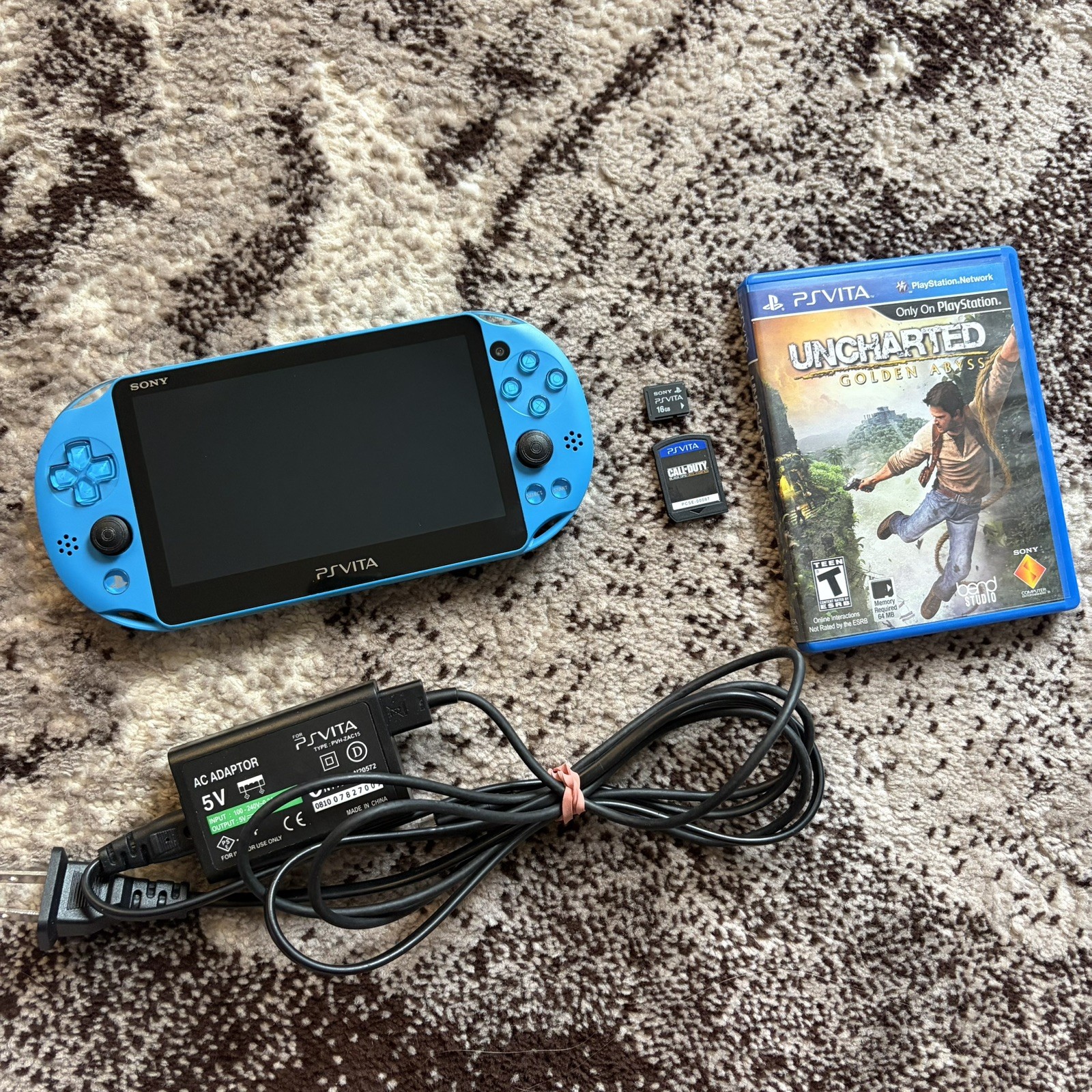 PS Vita Blue PCH-2000 ZA23 Slim Aqua Bundle, 2 Games + Charger 16GB Memory