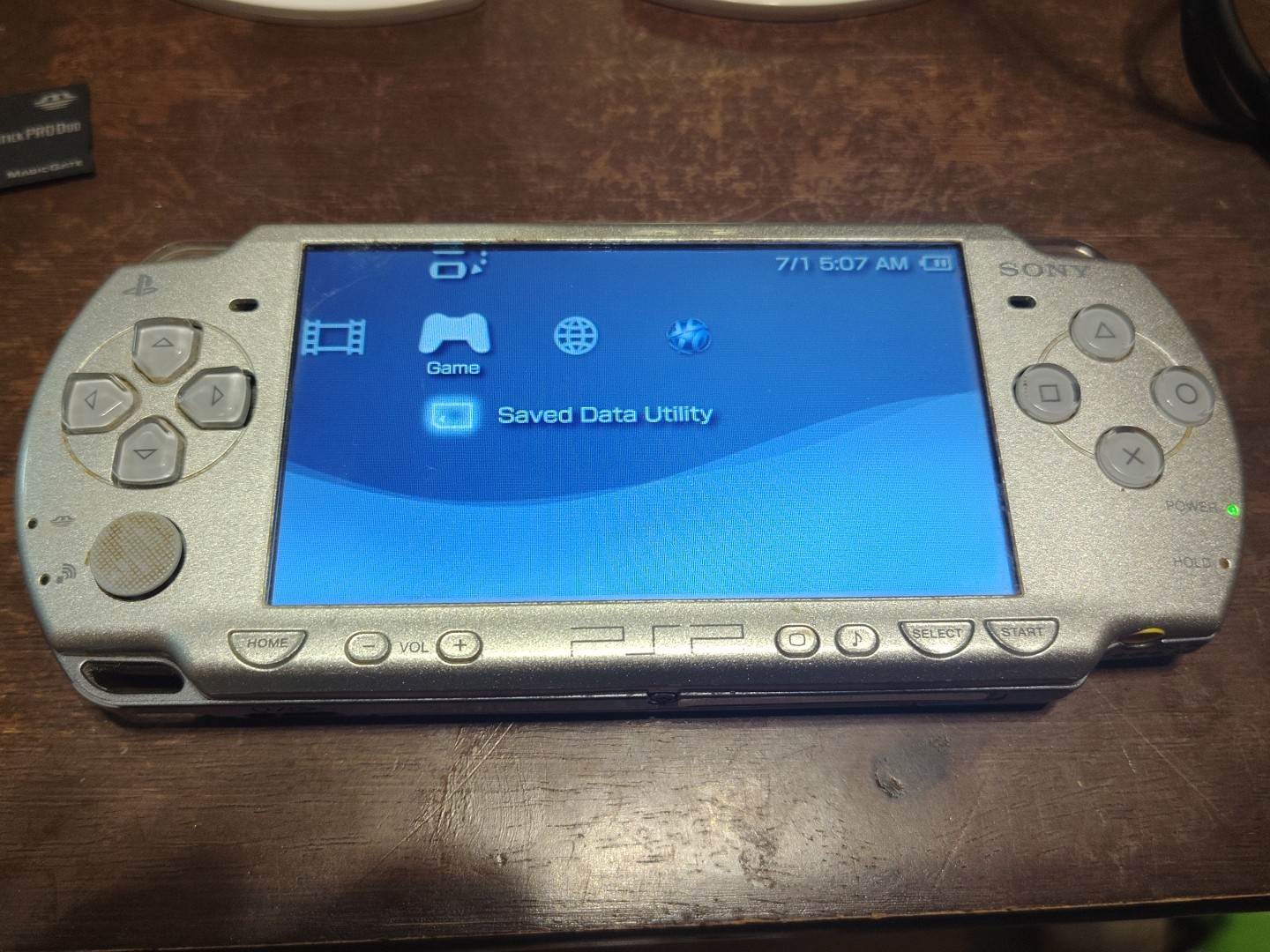 PSP 2001 Silver + 4 Games, 1Gb Memory Stick, Case And Charger
