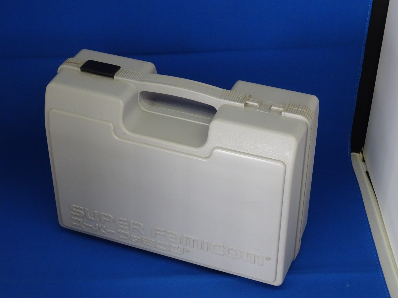SNES case for Super Mario Kart, Super Mario World, and Super Picross.SNES shelf