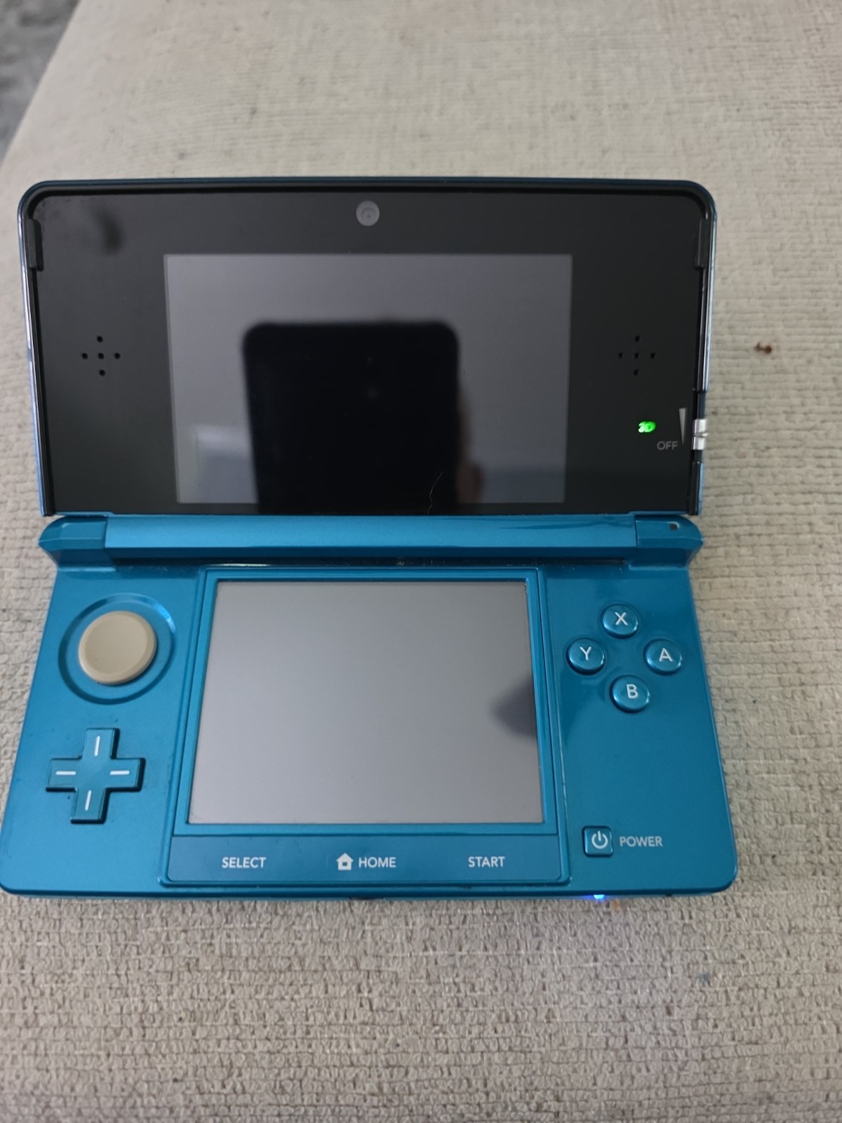 Nintendo 3DS 2GB Aqua Blue Handheld W/Charger, Stylus, & Pokemon Alpha Sapphire