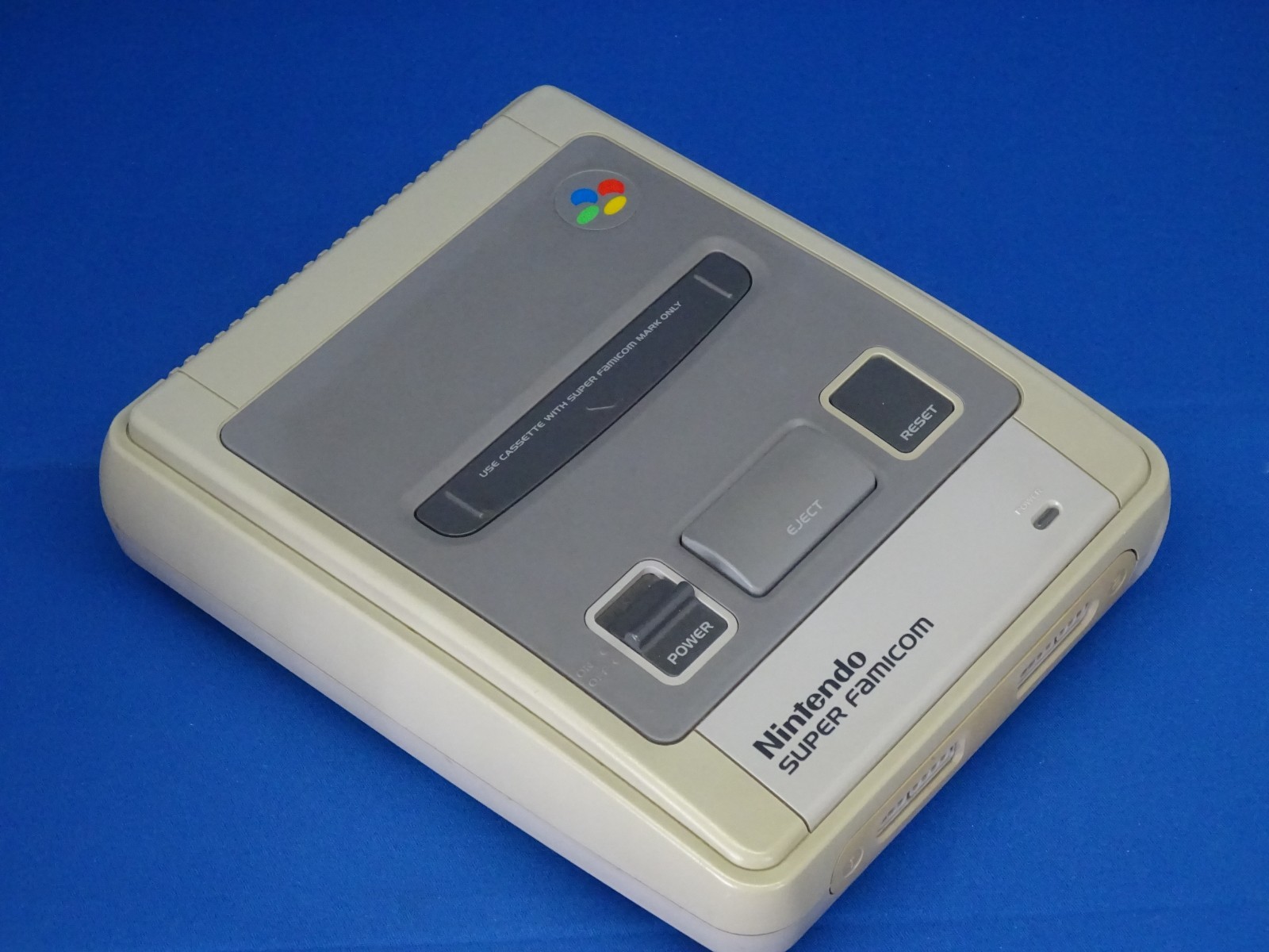 SNES case for Super Mario Kart, Super Mario World, and Super Picross.SNES shelf