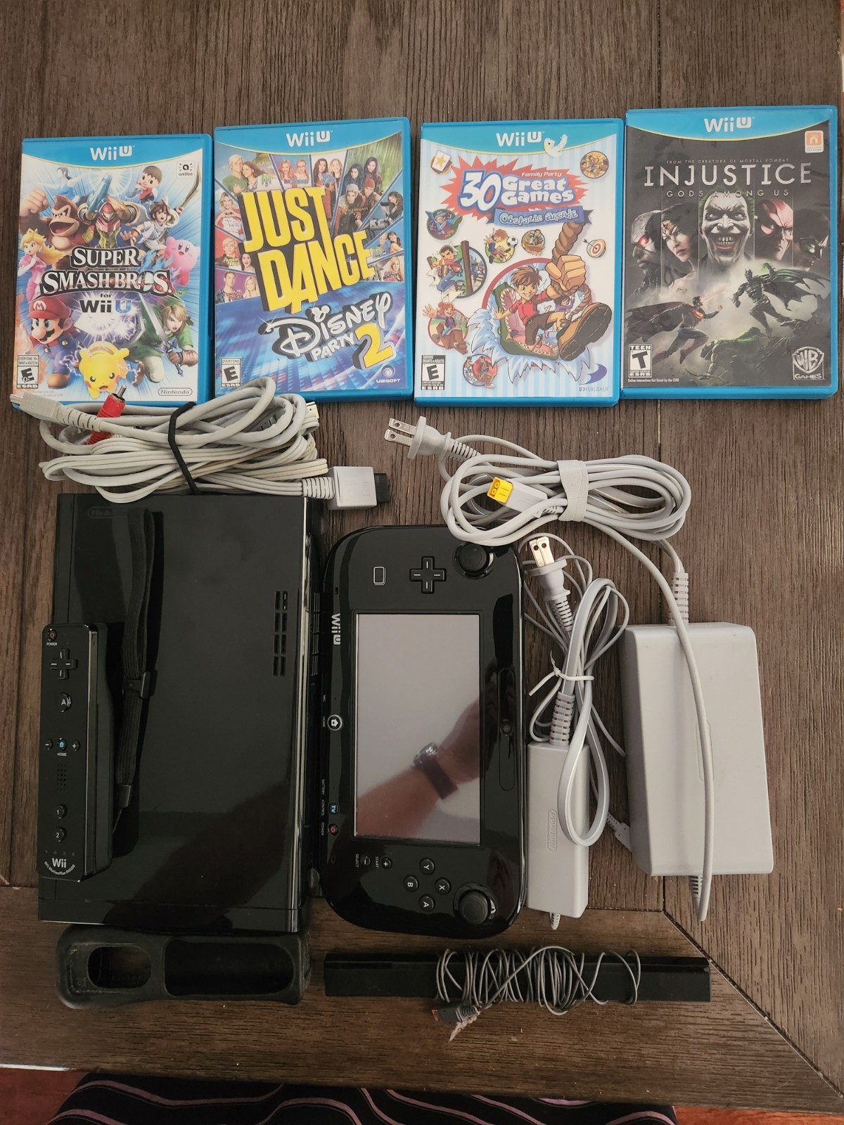 Nintendo Wii U Black Console w/ GamePad, 1 Wii Remotes, & 4 Games