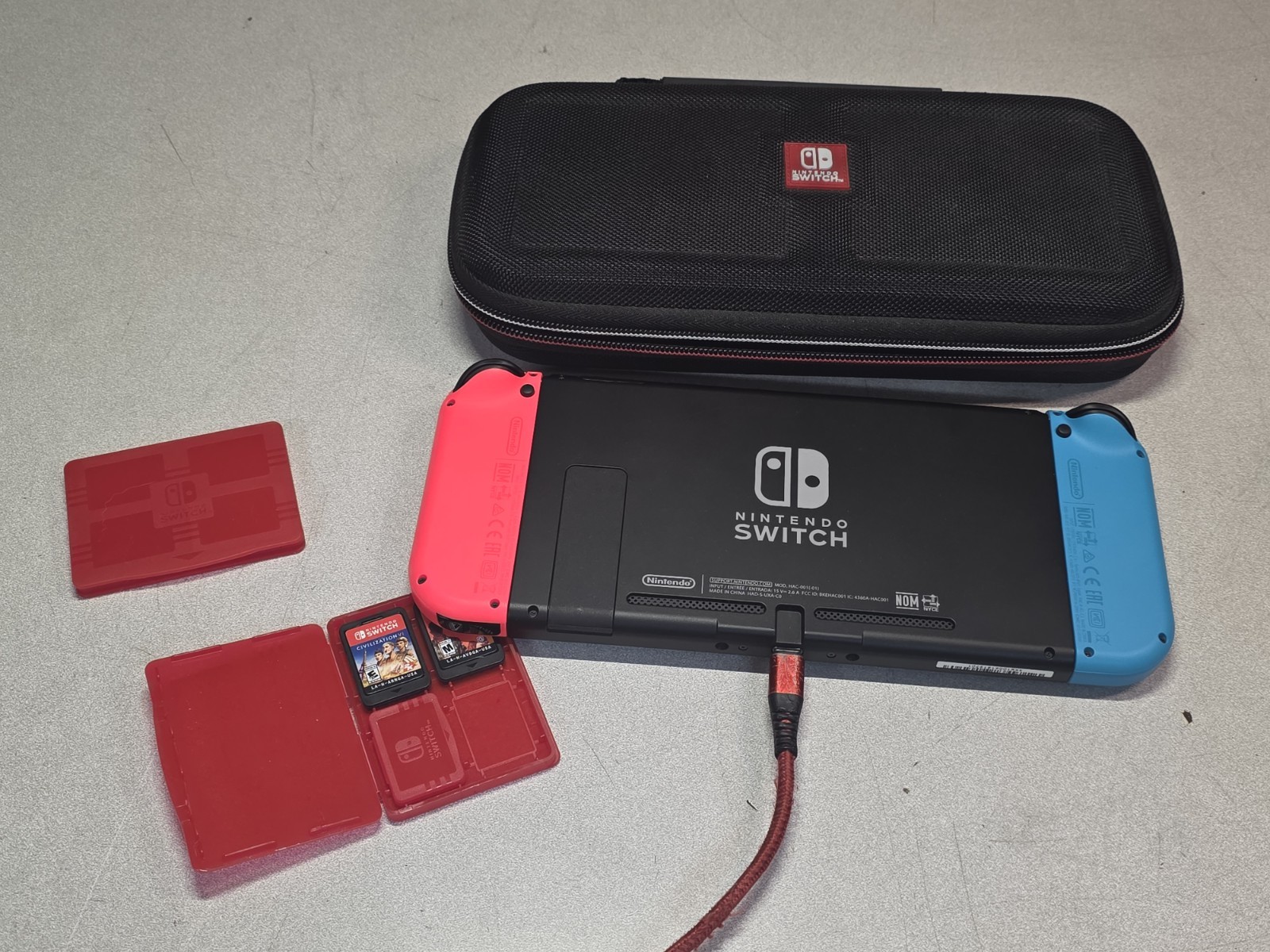 Nintendo Switch Console Red/ Blue w/ case & 3 Games