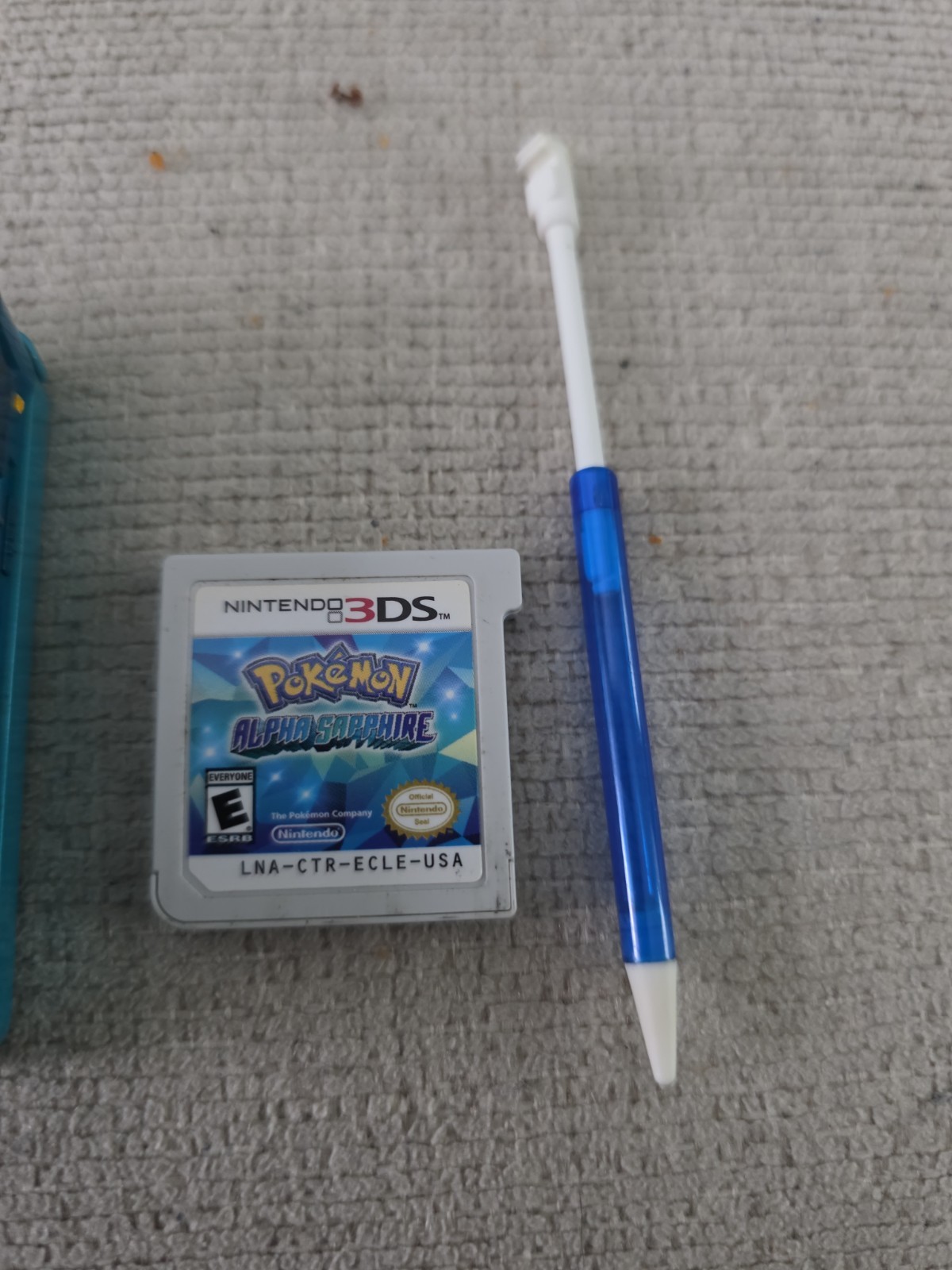 Nintendo 3DS 2GB Aqua Blue Handheld W/Charger, Stylus, & Pokemon Alpha Sapphire