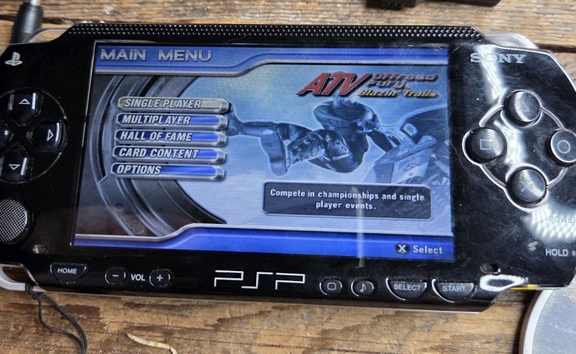 Sony PSP Black System With Charger, 3 Games (Description), And 2 Batteries