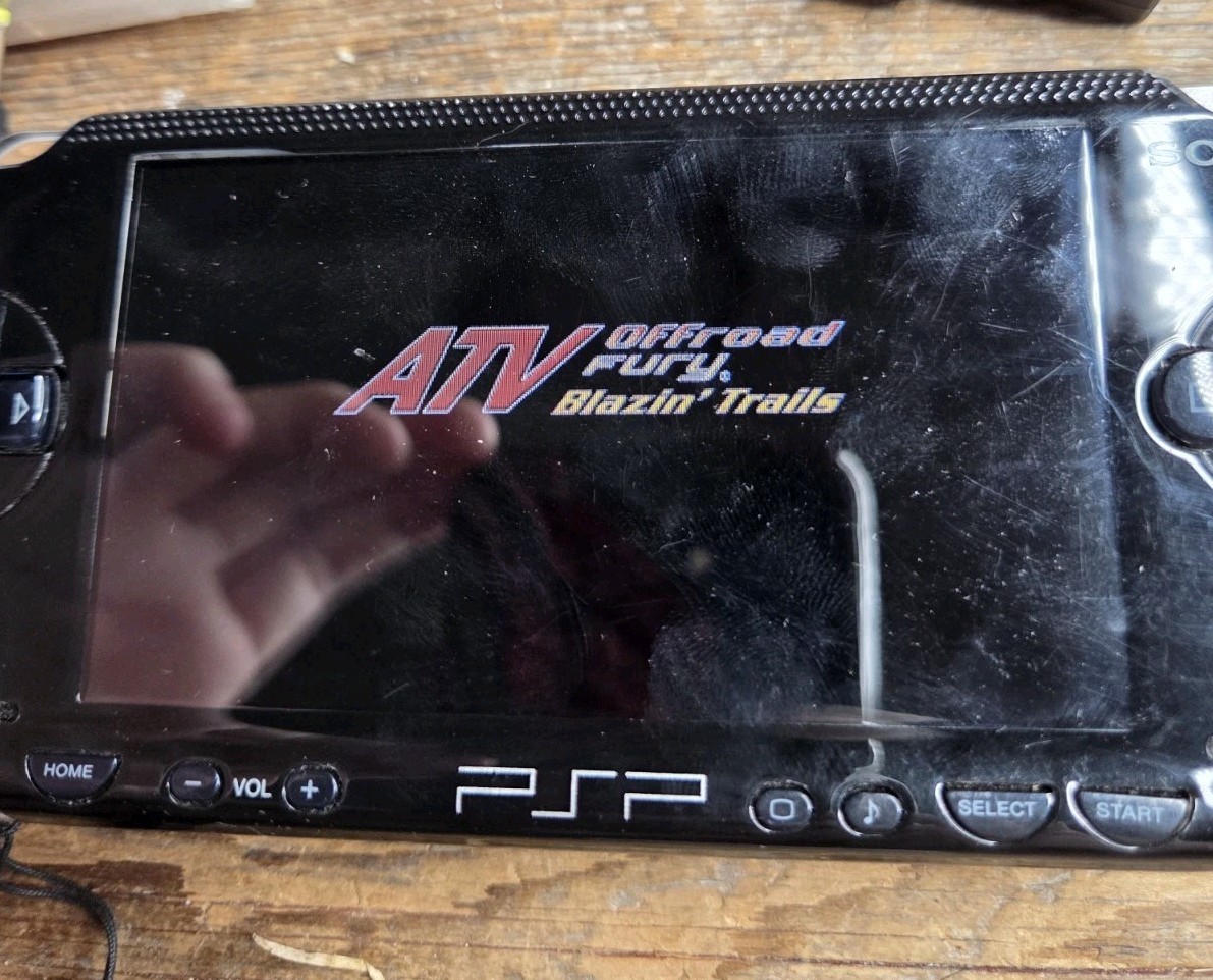 Sony PSP Black System With Charger, 3 Games (Description), And 2 Batteries