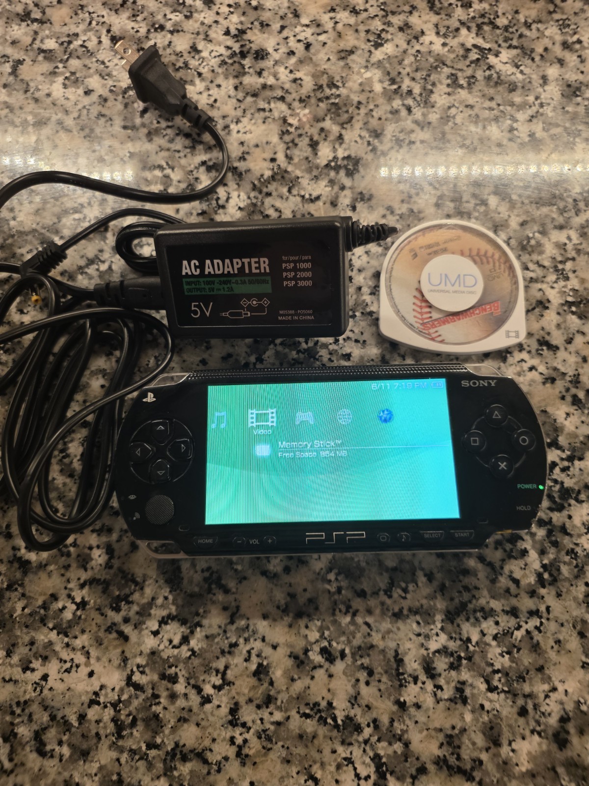 Sony PSP-1001 Black Handheld System NTSC-U/C UMD Compatible AC Adapter + UMD