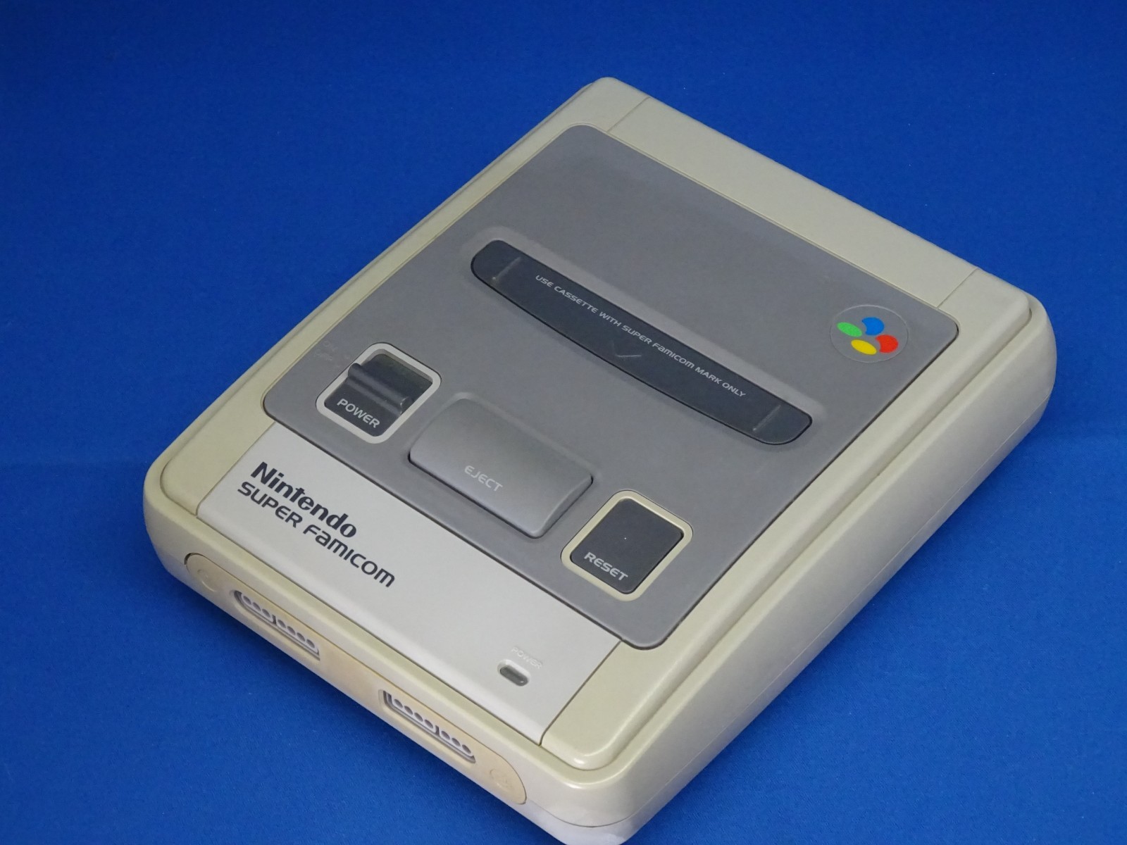 SNES case for Super Mario Kart, Super Mario World, and Super Picross.SNES shelf