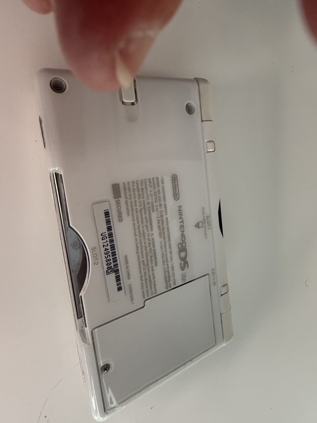 Nintendo DS Lite Handheld Console – Polar White Comes with two Games