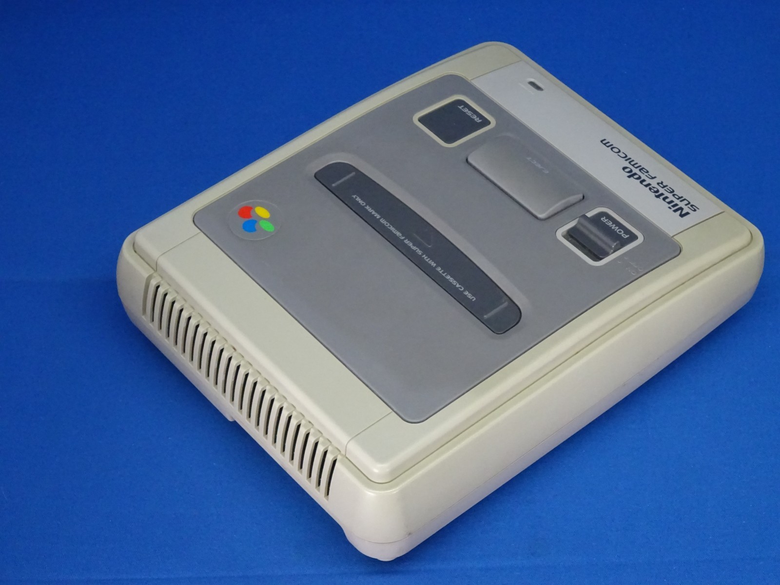 SNES case for Super Mario Kart, Super Mario World, and Super Picross.SNES shelf