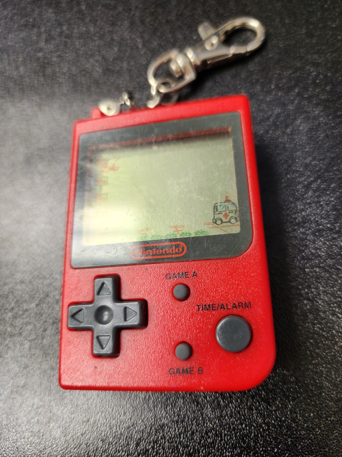 RARE 1998 Nintendo Mini Classic – Red Fire Keychain Game (Stadlbauer)