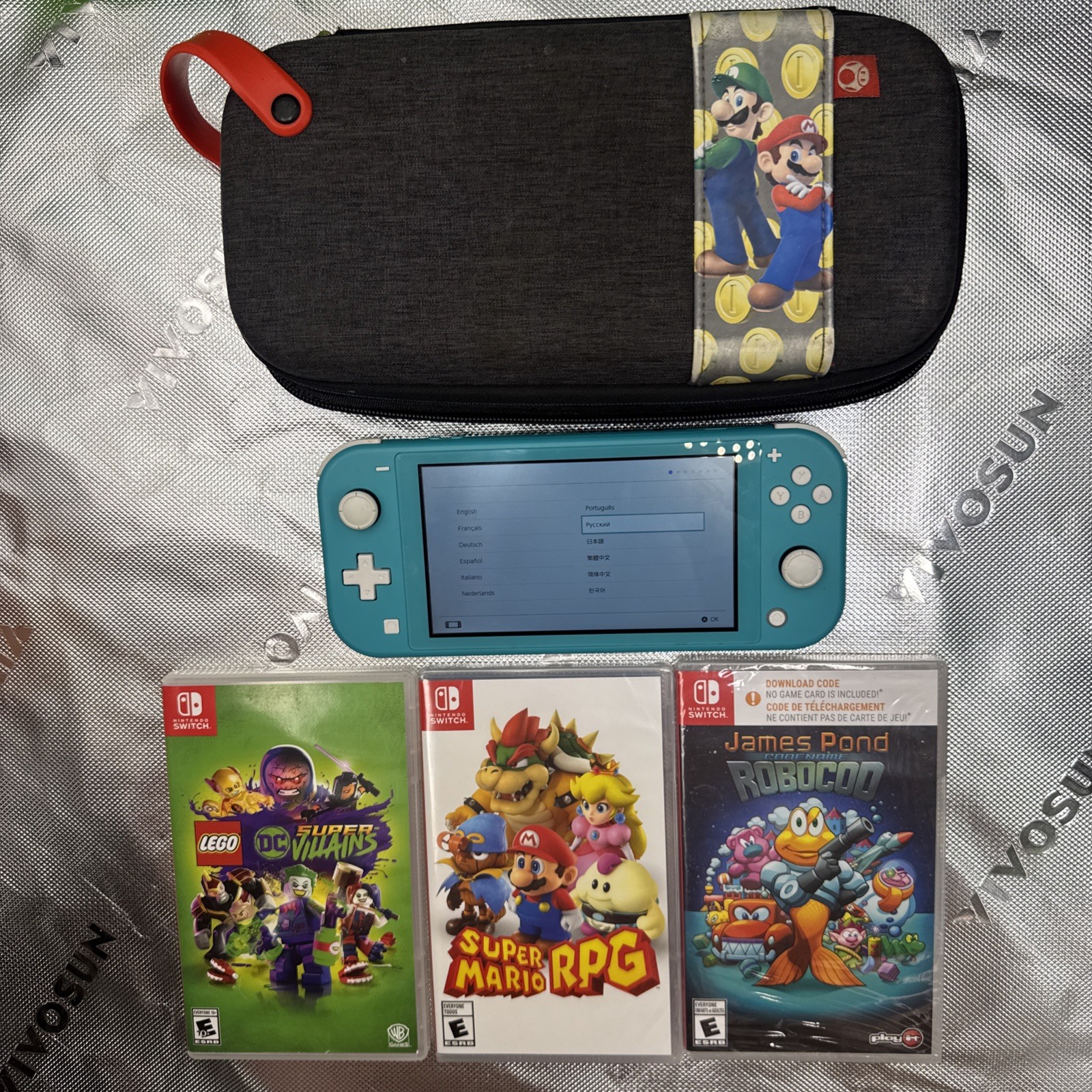 Nintendo Switch Lite 32GB Turquoise Handheld Gaming Console W/3 Games Mario Case