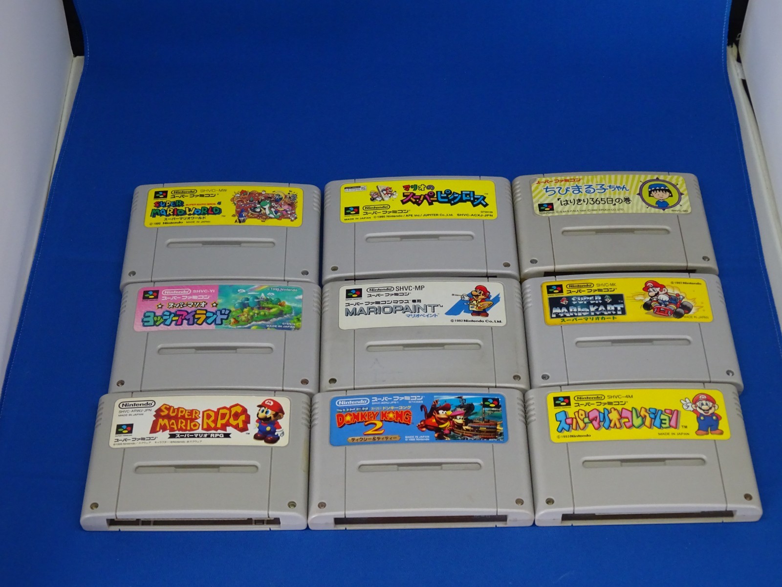 SNES case for Super Mario Kart, Super Mario World, and Super Picross.SNES shelf