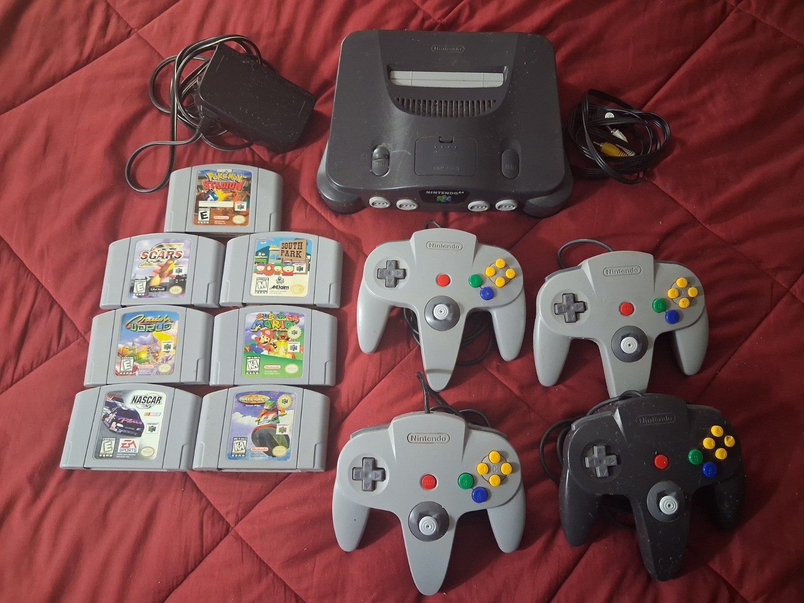 Nintendo N64 Console W/ Cables, 7 Games, And 4 Controllers. Turns On And Works.