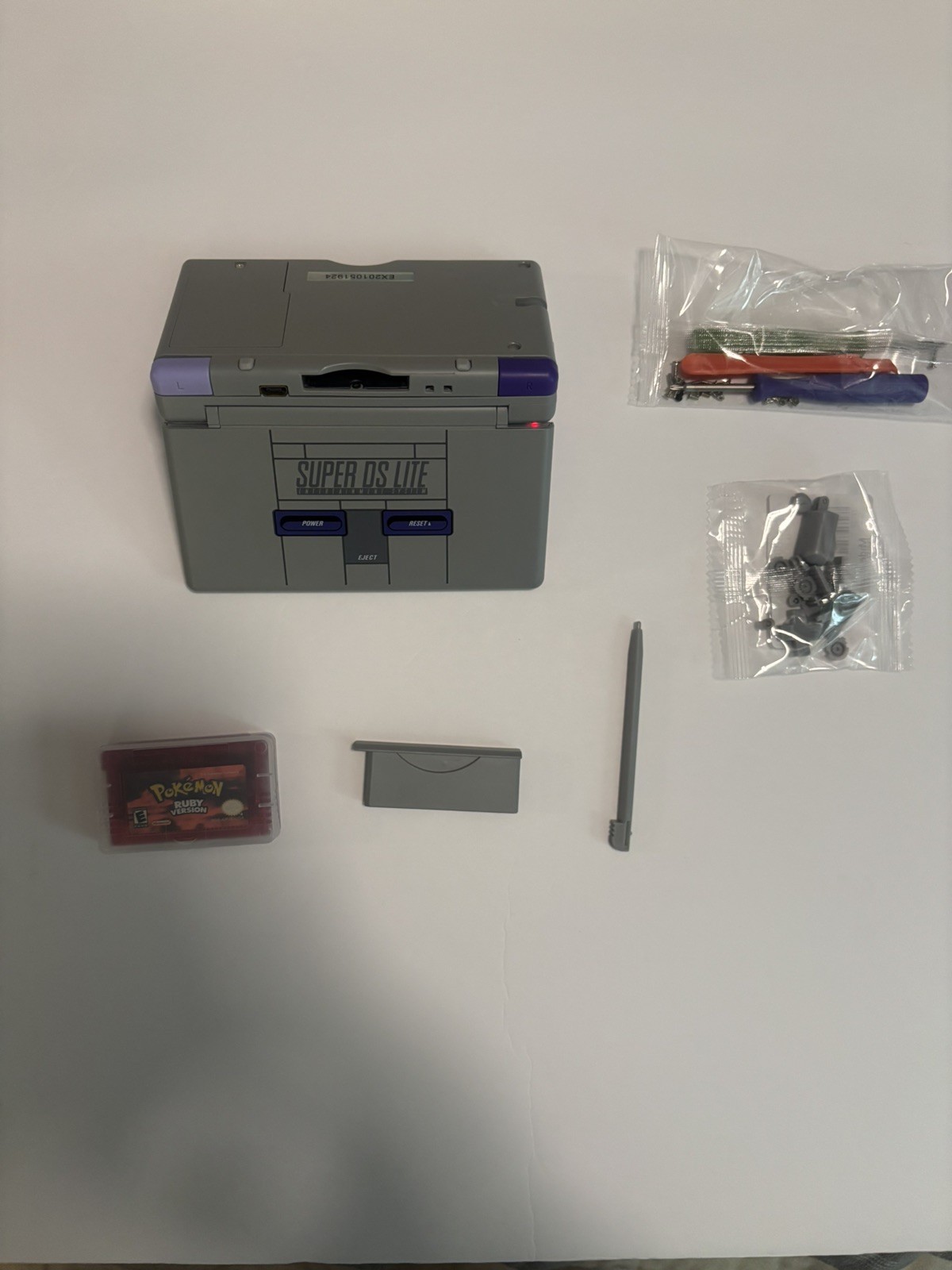 Nintendo ds Lite SNES Reshell With Charger, Ruby and screwdriver/buttons