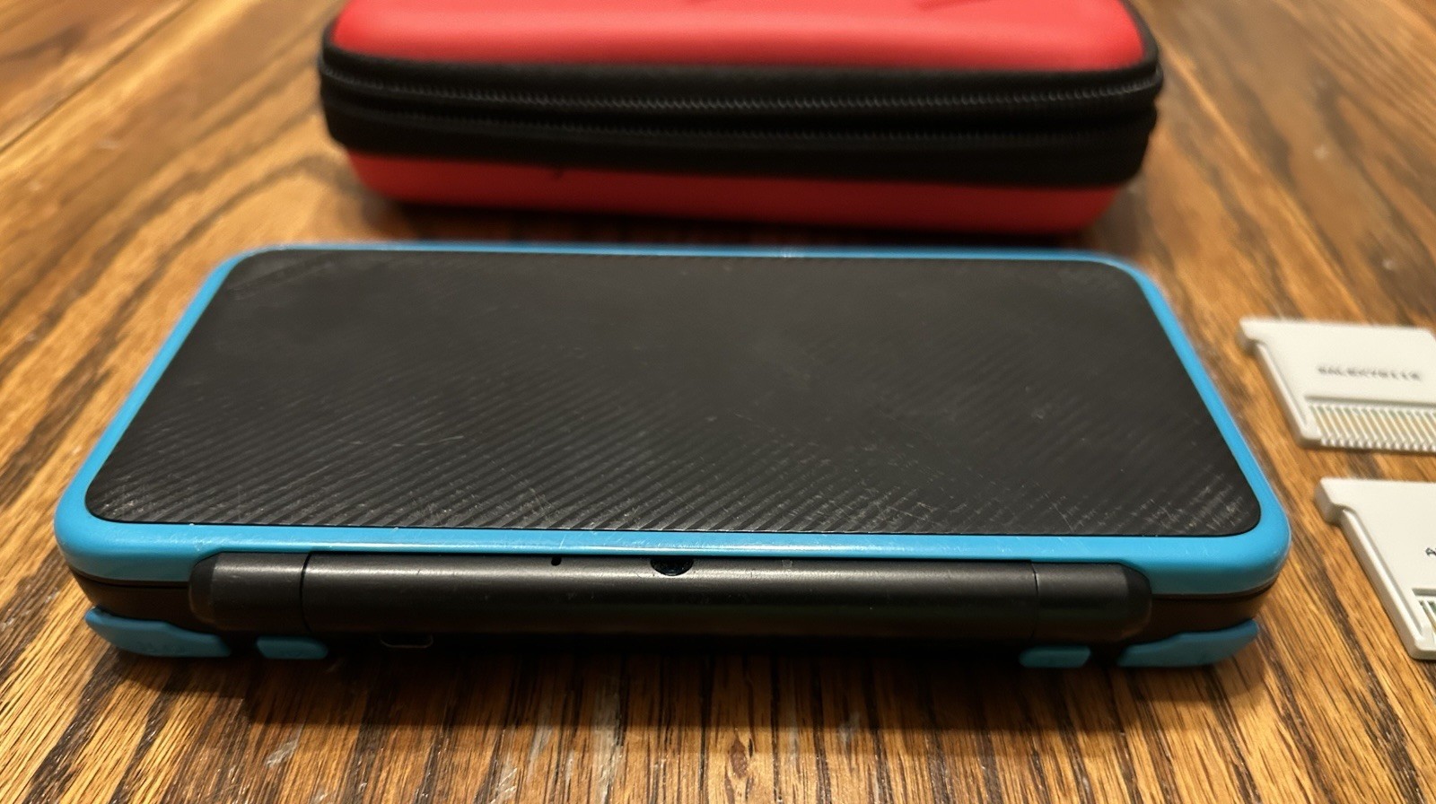 Nintendo 2DS XL Handheld Console w Mario Kart 7 Black/Turquoise Kirby Smash Case