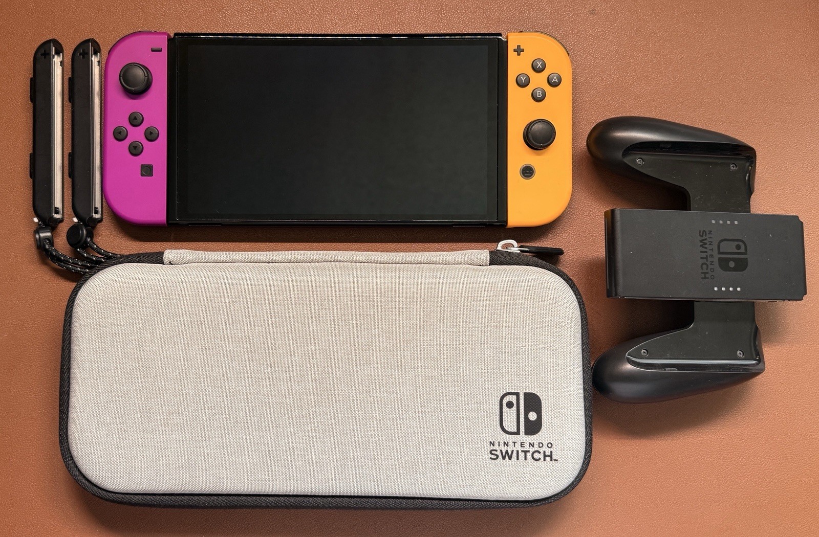 Nintendo Switch OLED Bundle Neon Purple Orange Joy-Con 512GB SD + Grip and Case