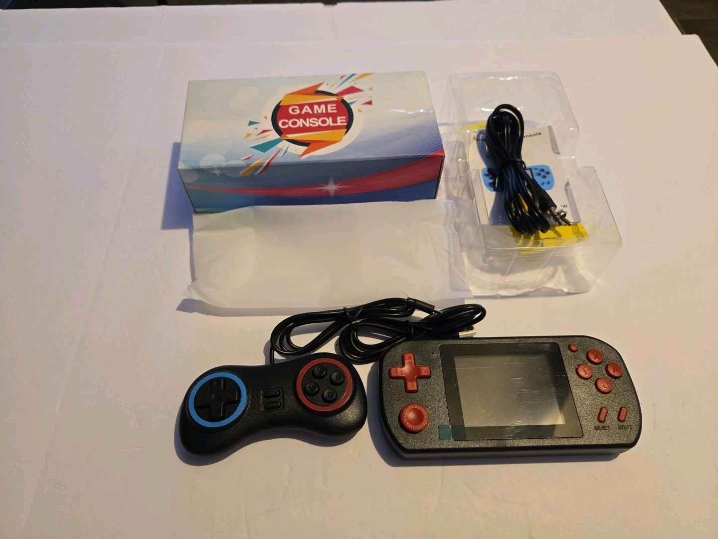 A Red Retro Classic Games Handheld And TV Small Game Console With Many Games
