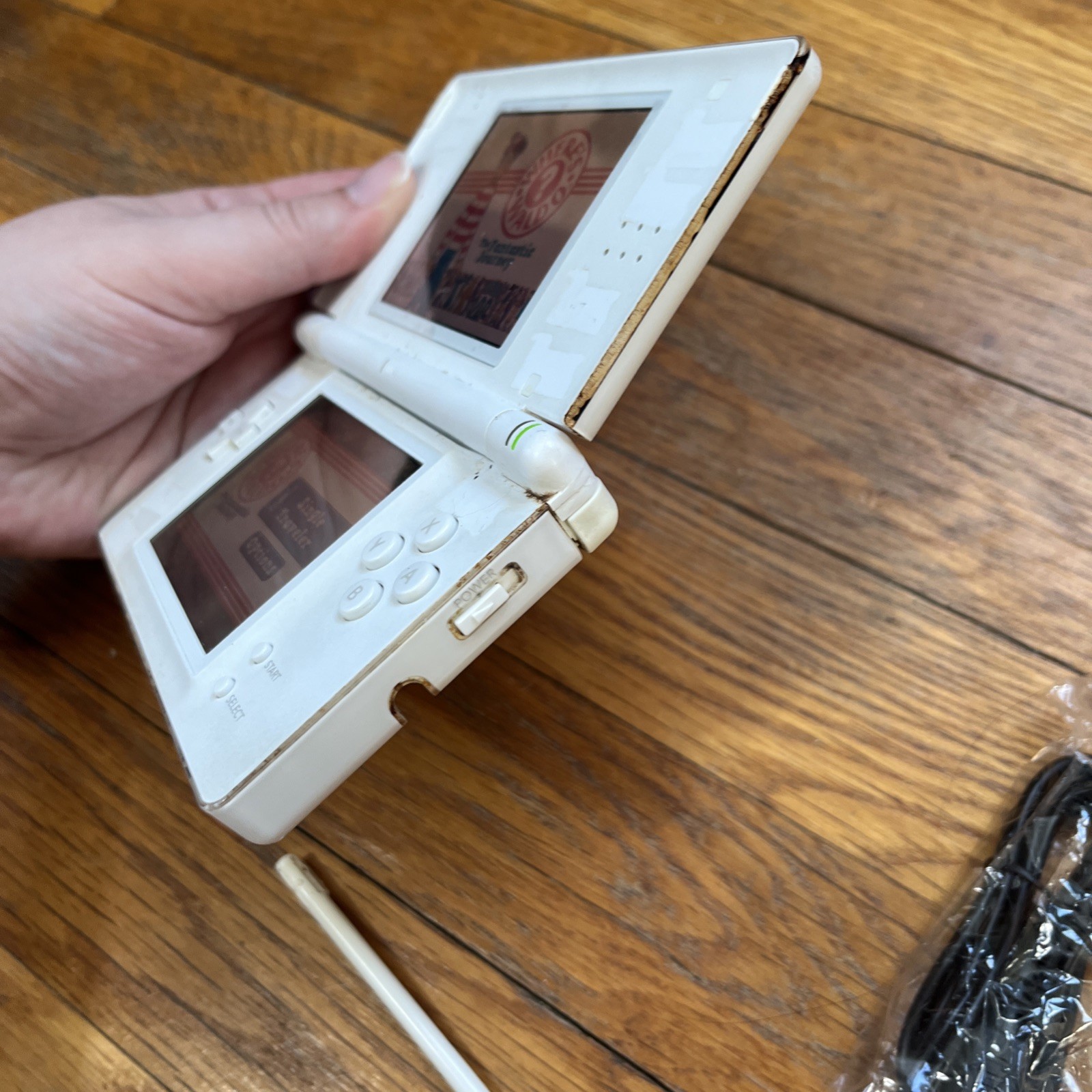 Nintendo DS Lite Handheld Console – Polar White and game charger stylus works