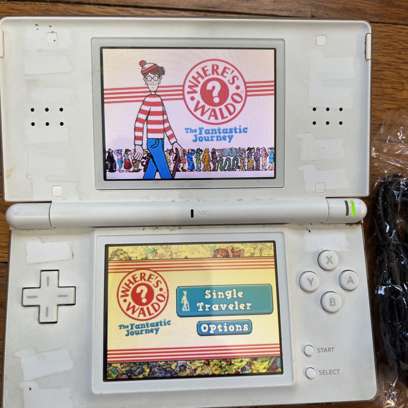 Nintendo DS Lite Handheld Console – Polar White and game charger stylus works