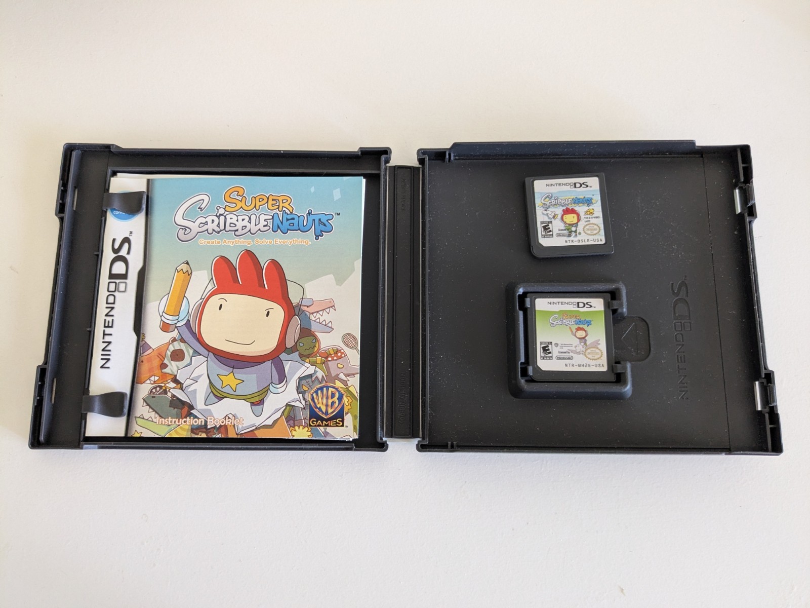 Nintendo DS Lite Black, with Charger (NO stylus) + Lot Of 28 Games – Used, Good