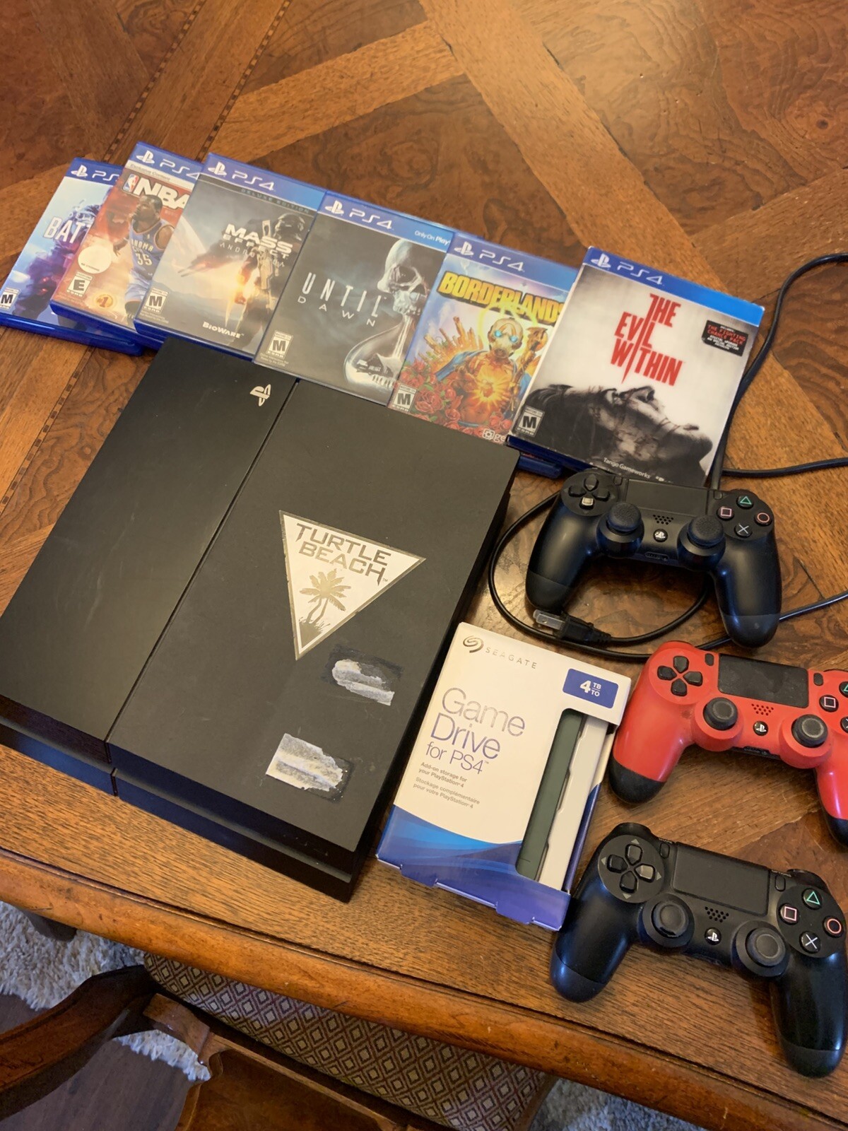 playstation 4 console, 4TB Seagate Hard Drive, Three Controllers, Various Games.
