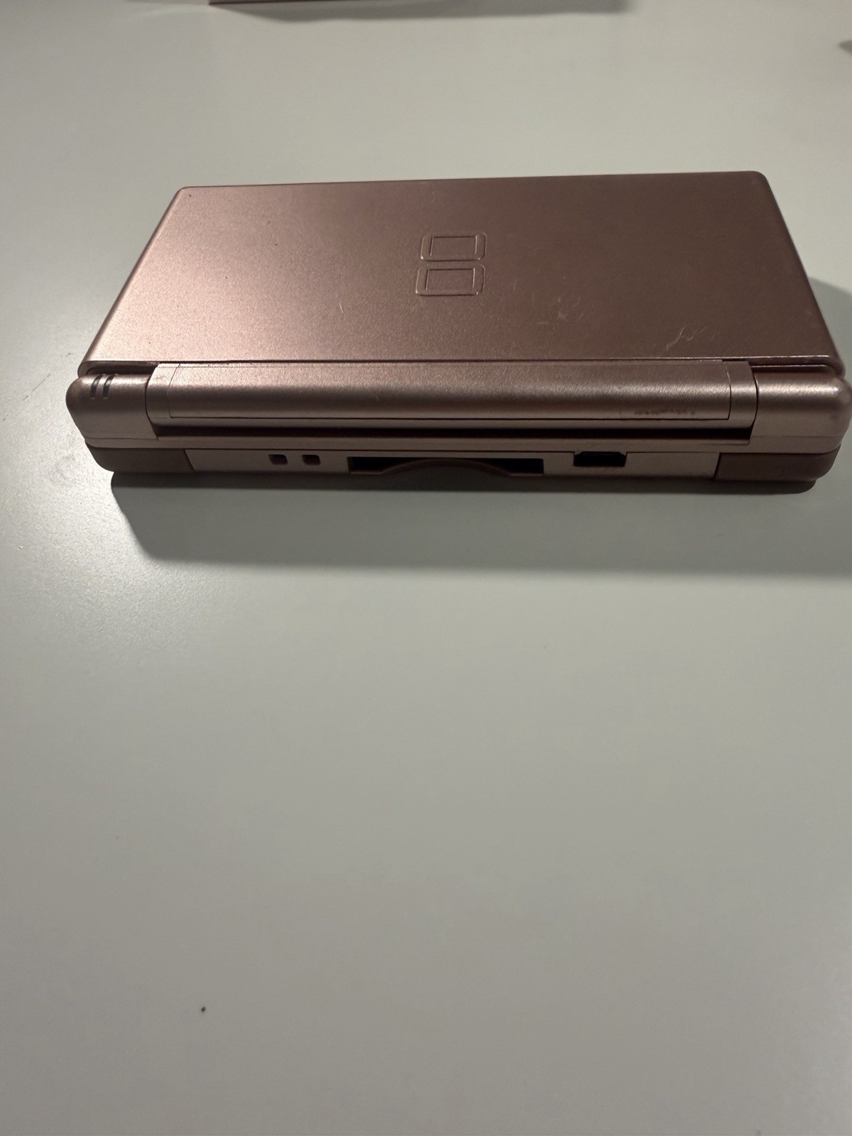 Nintendo DS Lite Metallic Rose System With Charger, Original Box, And 2 Cases