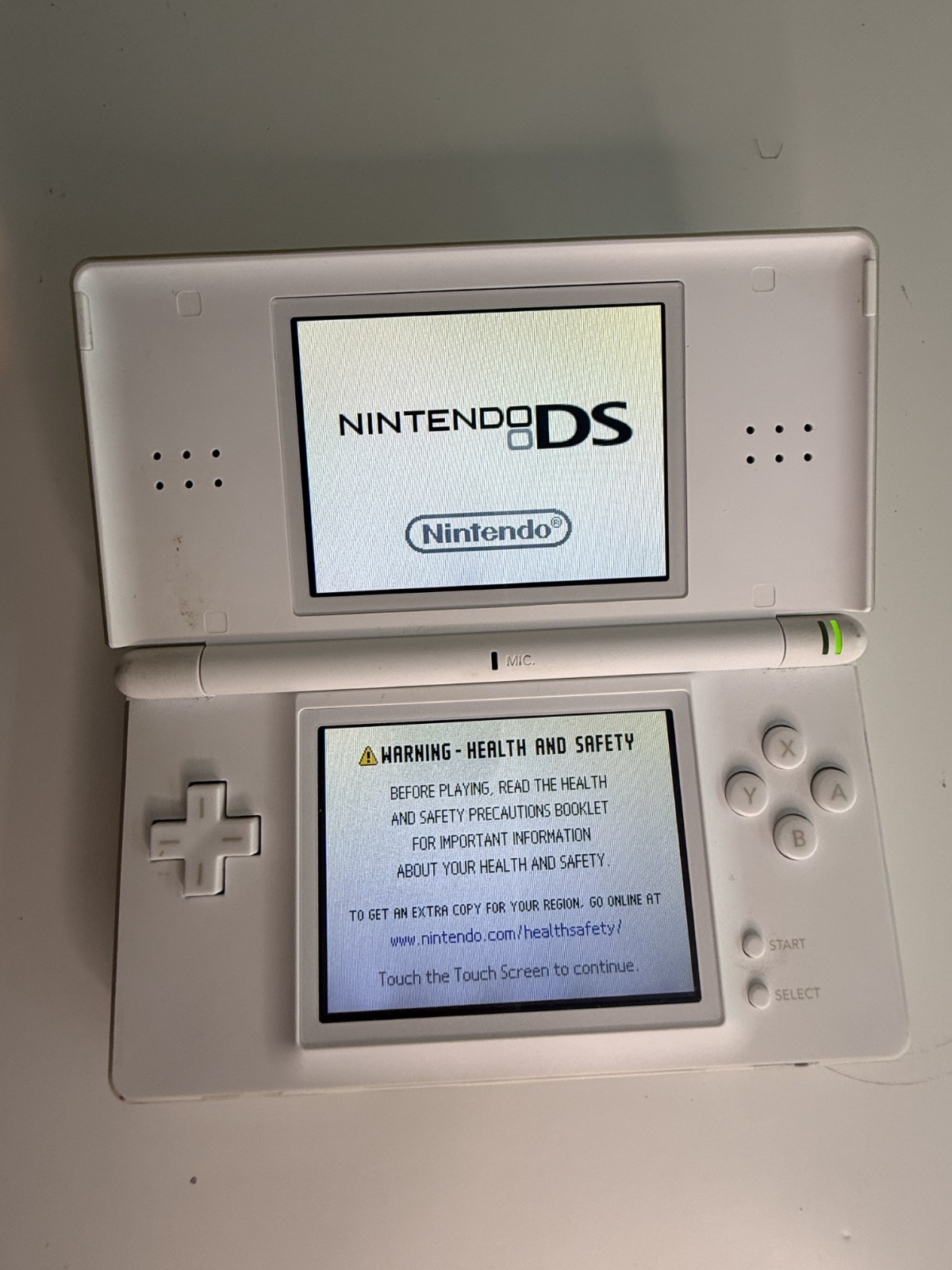 Nintendo DS Lite Handheld Console – Polar White Comes with two Games