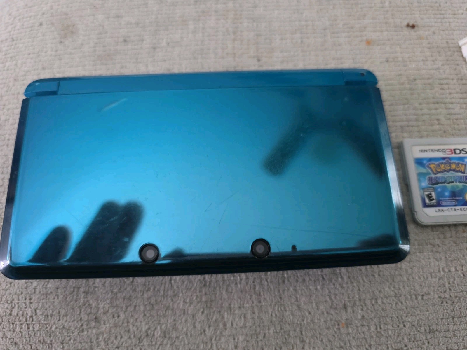 Nintendo 3DS 2GB Aqua Blue Handheld W/Charger, Stylus, & Pokemon Alpha Sapphire